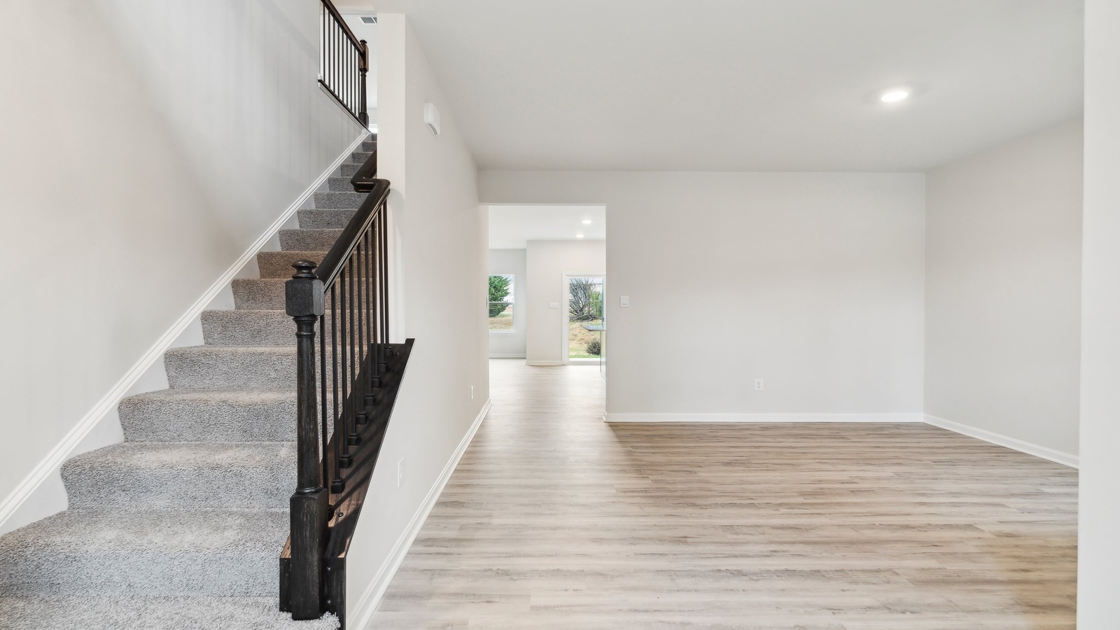 Smartly designed dining room in D.R. Horton Oak Crest Townhomes near main foyer, kitchen, living room, stairs