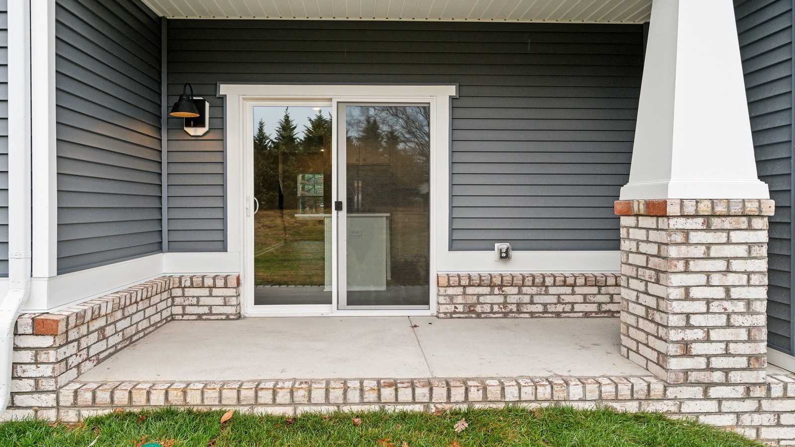 New D.R. Horton townhome featuring covered paved patio for outdoor entertaining and backyard space ideal for gatherings