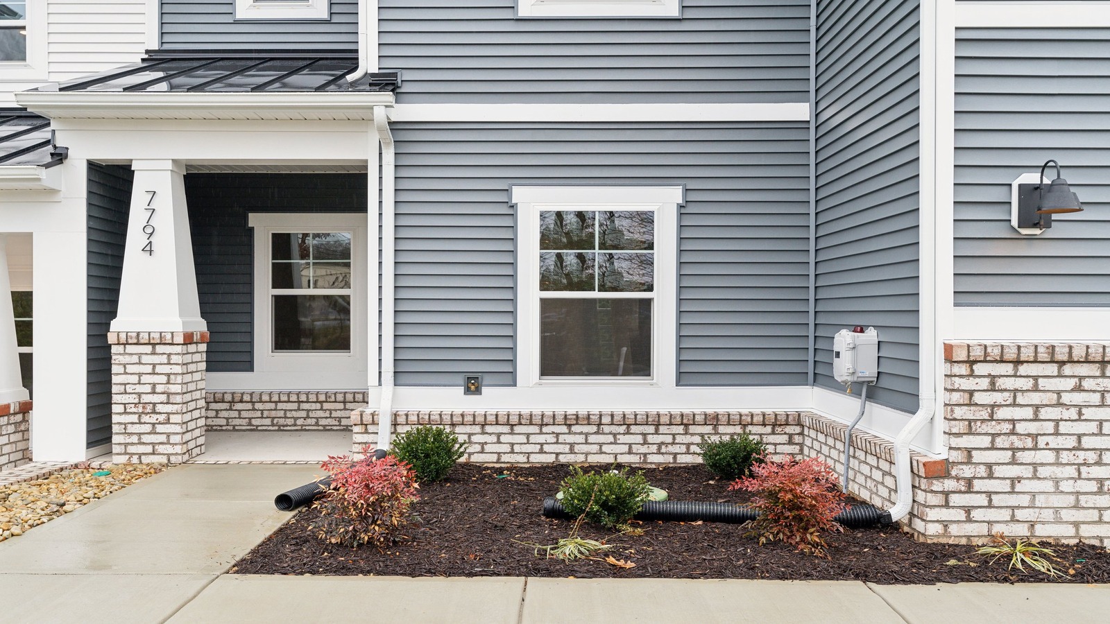 Oak Crest Townhomes home front porch main door entry, accessing the entrance in the townhome, living areas