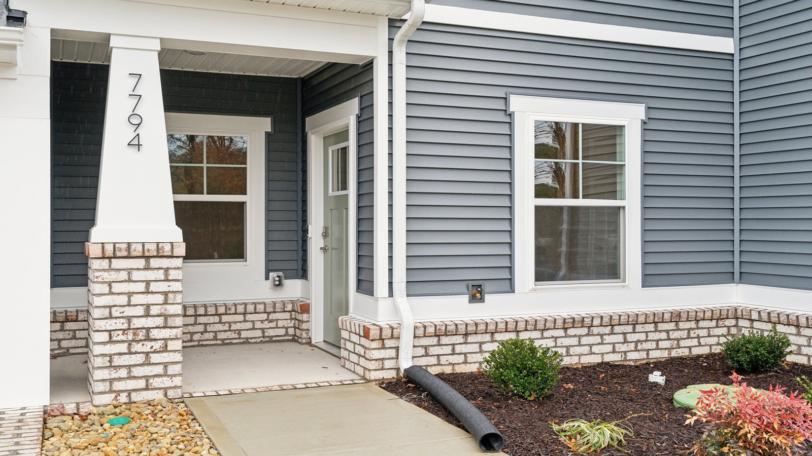 Oak Crest Townhome front porch main door entry, accessing the entrance in the home, living areas
