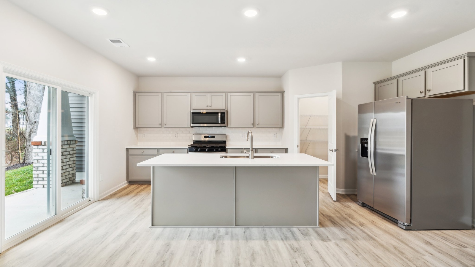 Kitchen-dining-great room-living spaces combo, connectivity to the new home at Oak Crest Townhomes