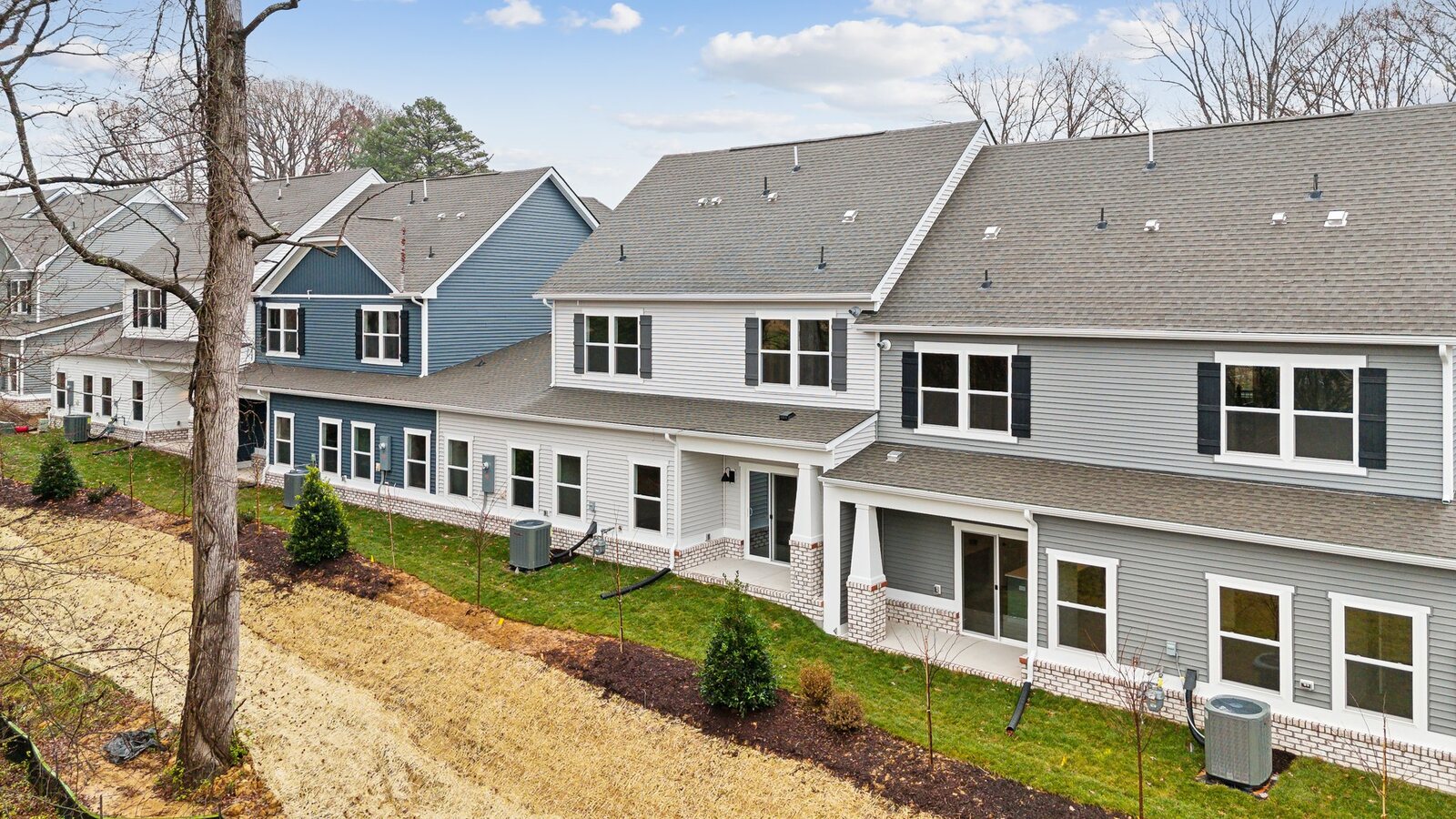 Covered Concrete rear patios in this D.R. Horton townhome community adding outdoor living, private backyard