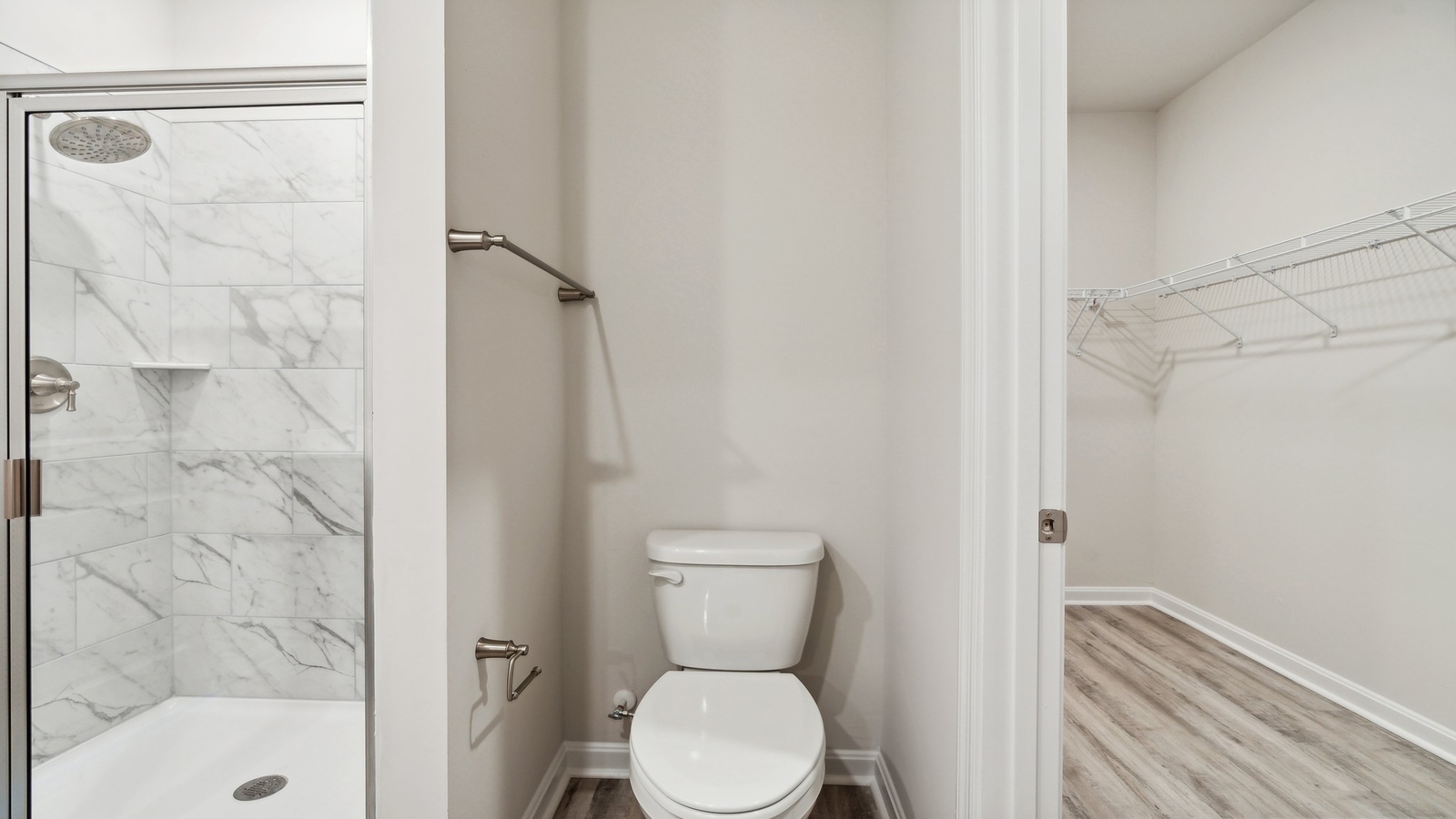 Owner’s ensuite new townhome offers a functional layout with walk-in closet, spa-like shower,bath walk-in closet designs