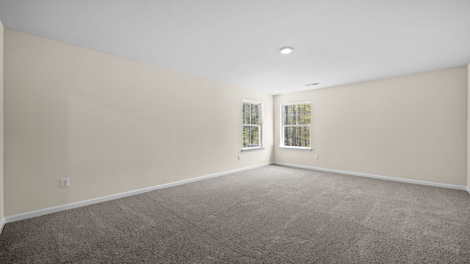 Primary bedroom designed for privacy and space with clean lines and a convenient flow into en-suite bathroom and walk-in closet