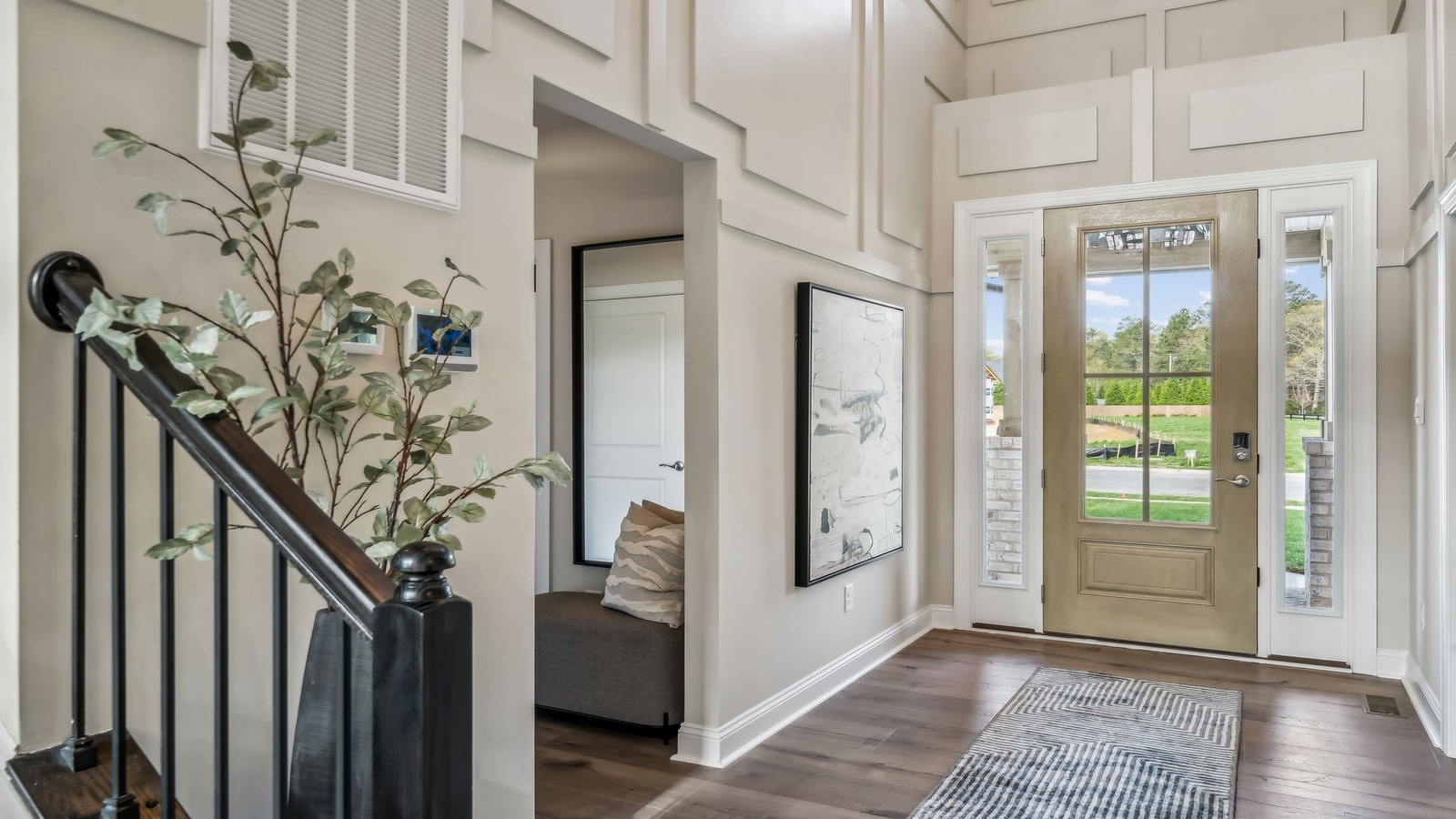 Our Stunning New Home entry hallway, Stairway upstairs, is designed for connecting the front to the home to gathering areas