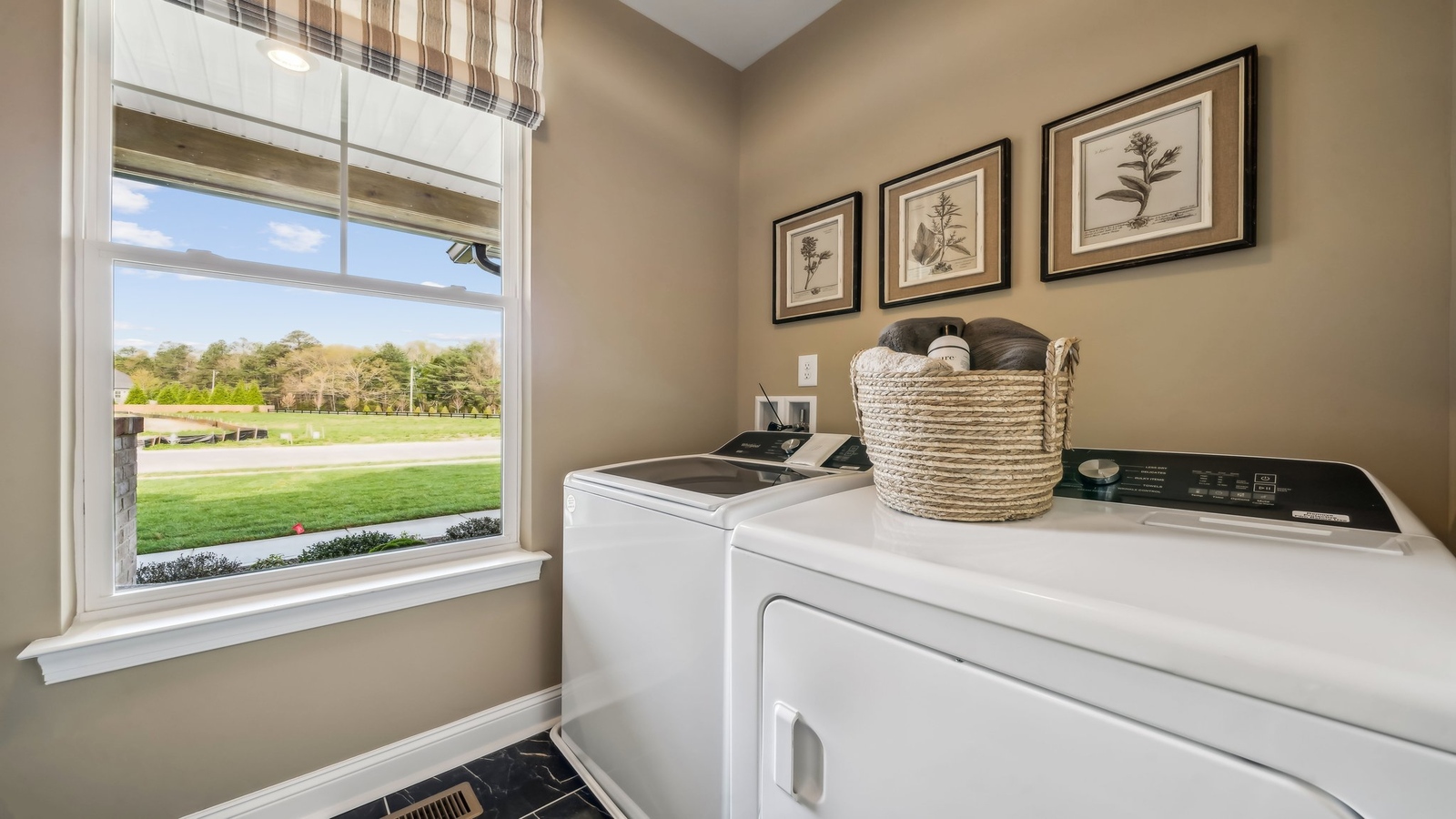 Maidens Farm utility laundry room includes smart designed overhead storage for efficient home organization