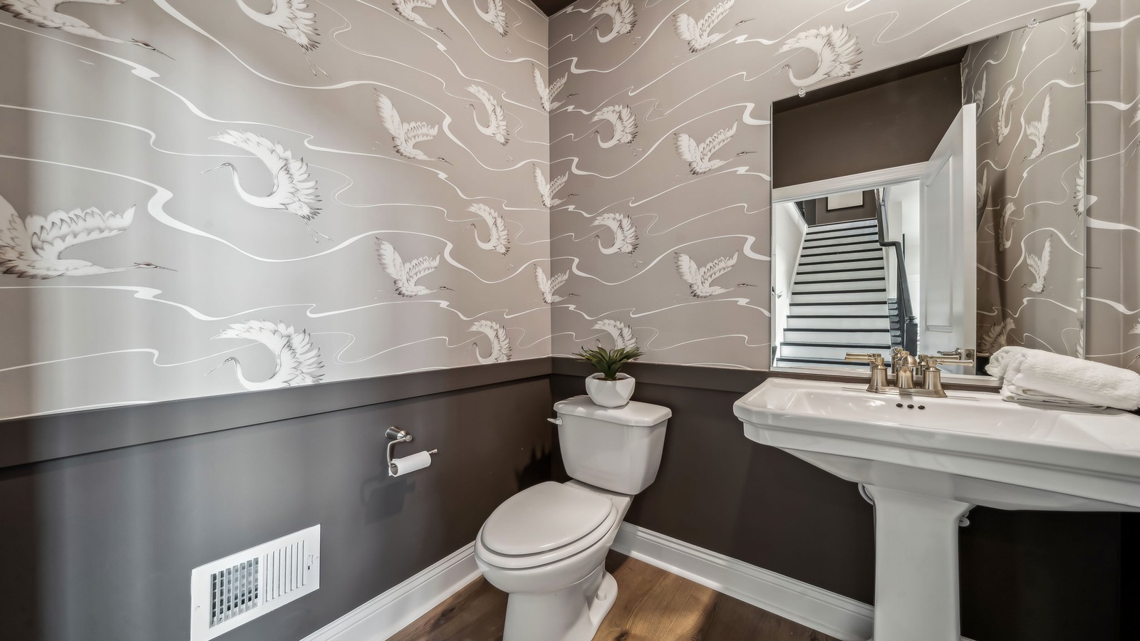 Our Half bathroom with pedestal basin, mirror and overhead vanity lighting in Maidens Farm