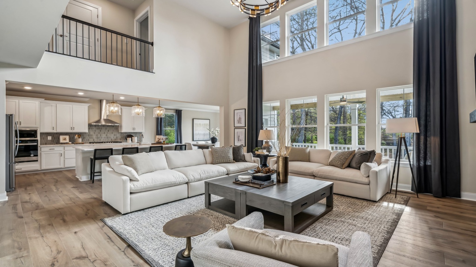 Maidens Farm new build featuring entry-adjacent two-story curtains in the living room