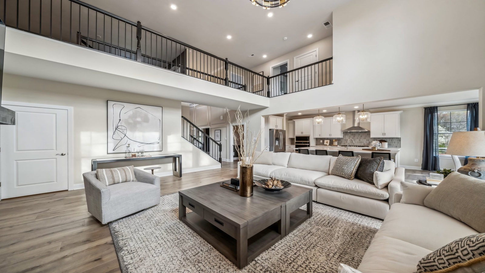 Maidens Farm new residence with dramatic front living room with electric fireplace just off entryway