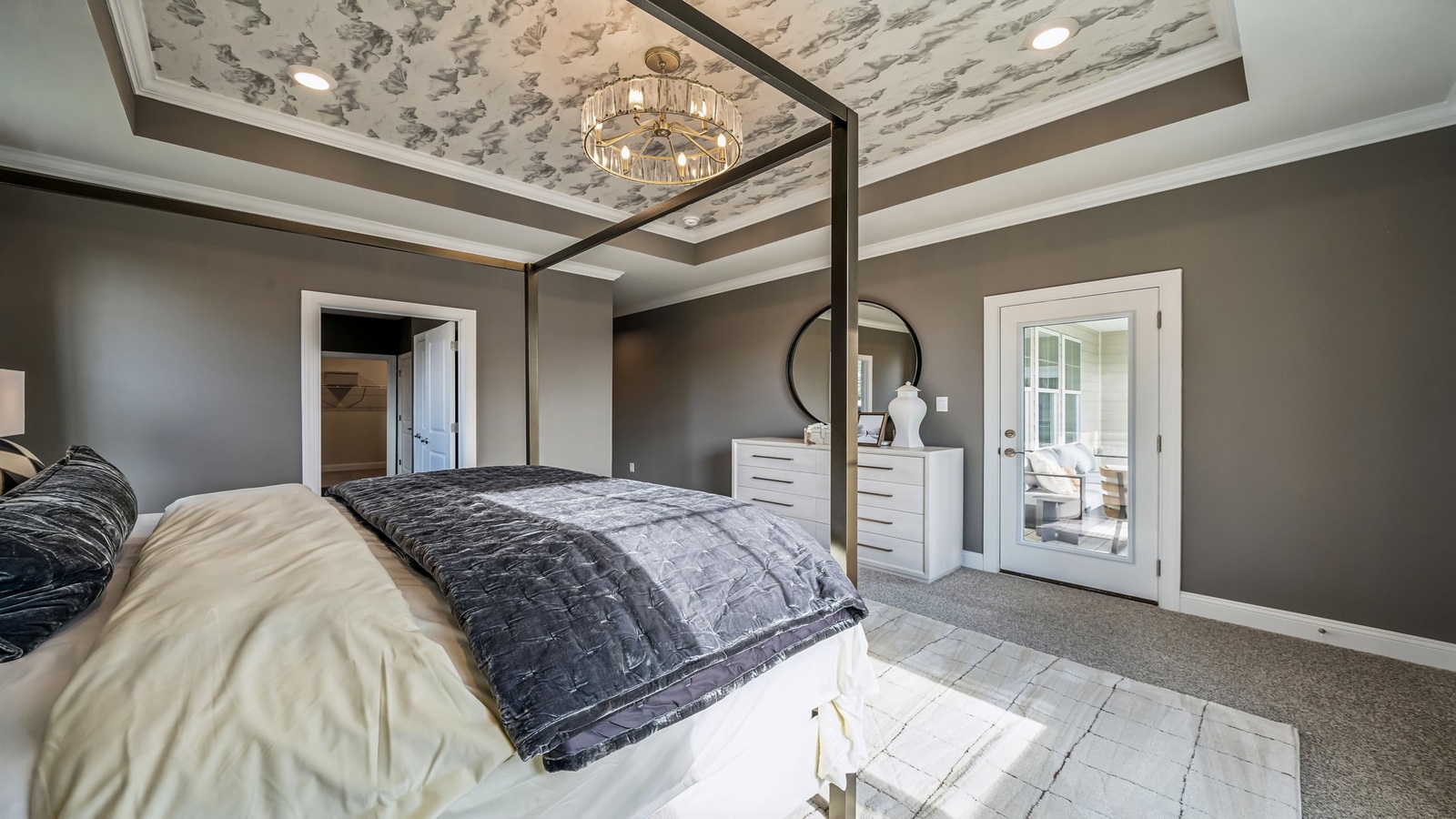 Owner’s suite offers natural window light, a premium spa-inspired en-suite bathroom, and a walk-in closet for everyday comfort