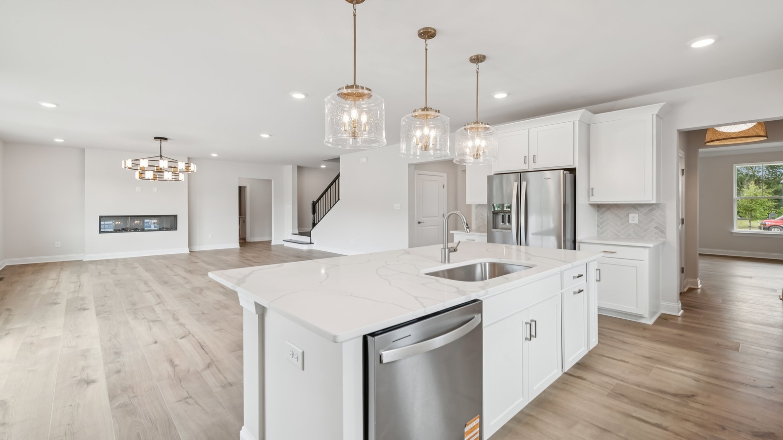 Central kitchen island with dining crafted to anchor the home with pantry, meal prep zones, guest and everyday gathering