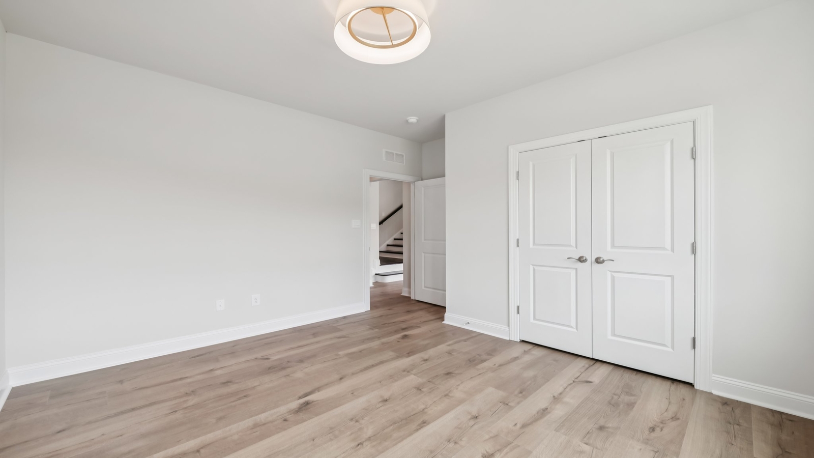 Dining area with nearby kitchen island, backyard view and open-concept plan for entertaining Sheppard Mill