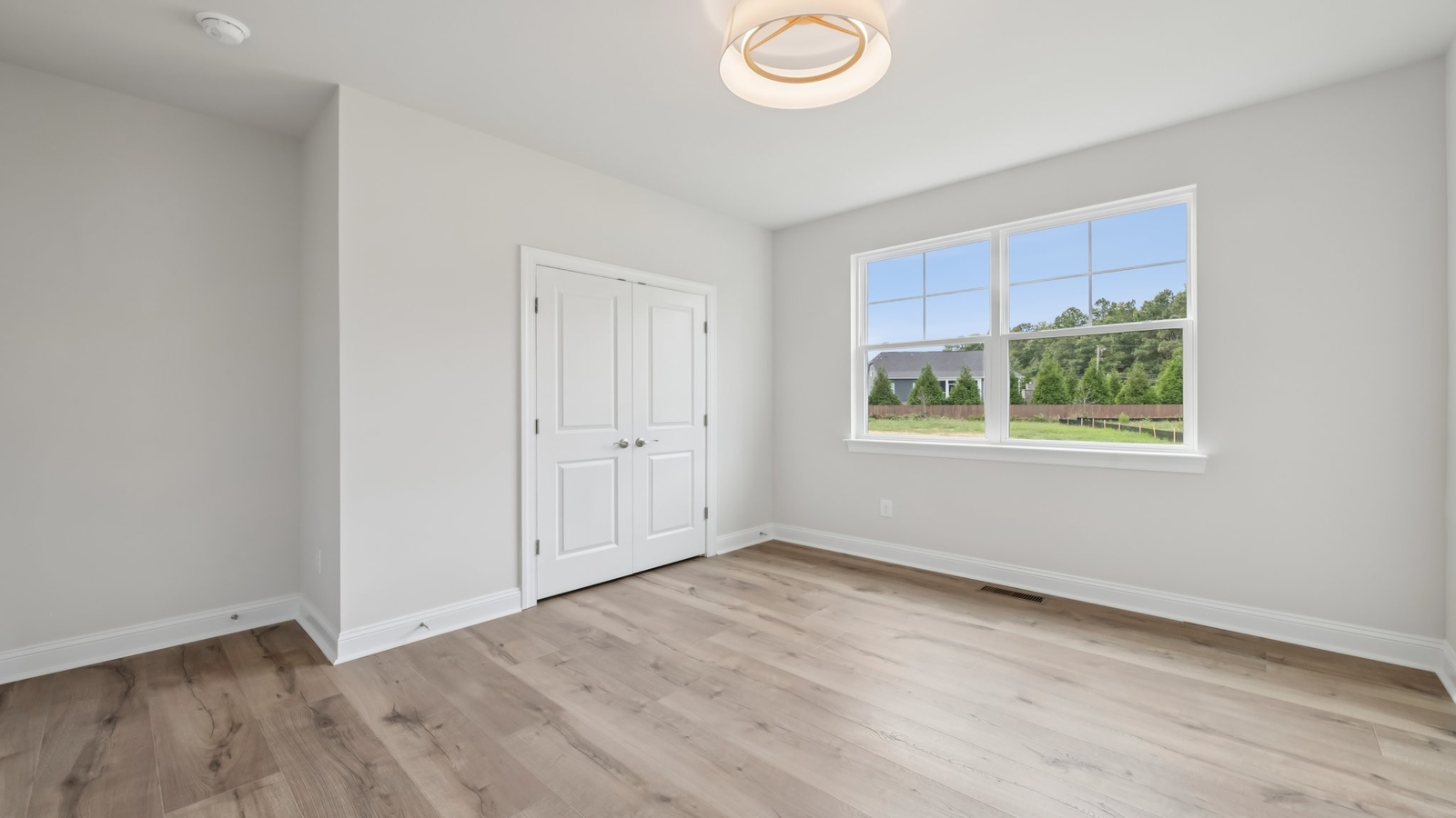 Dining room with natural light, and seamless flow into kitchen-living areas