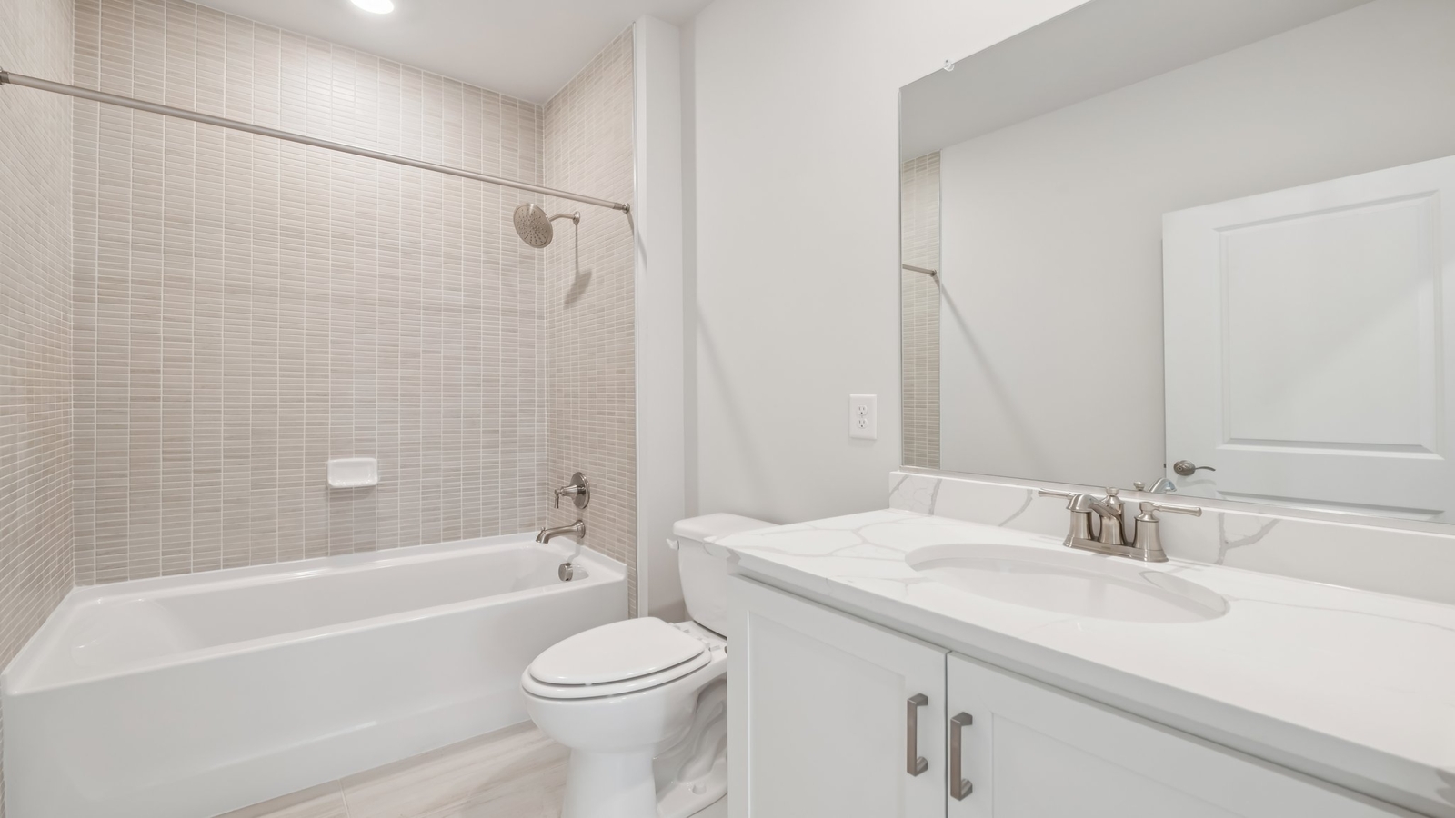 Modern family bath with vanity lighting, storage, quality fixtures in tub-shower combo Sheppard Mill