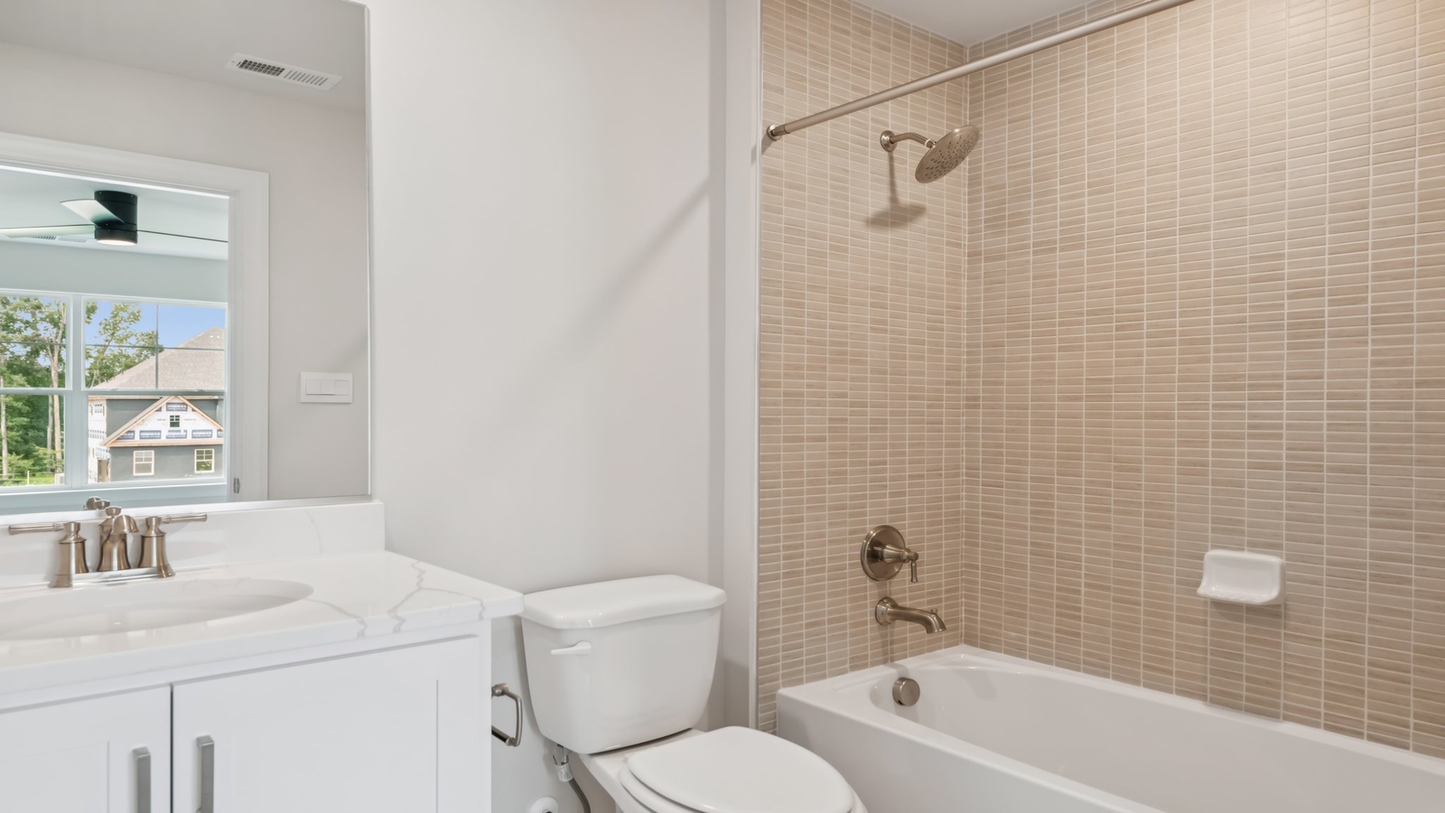 Secondary bathroom with combination shower-tub, cabinet storage at Sheppard Mill