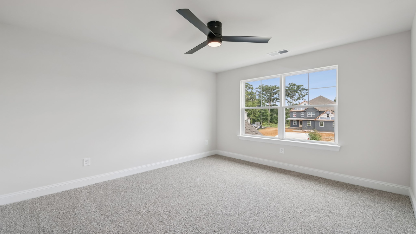 Secondary Bedroom showcases space via single door closet, window, convenient home access Sheppard Mill