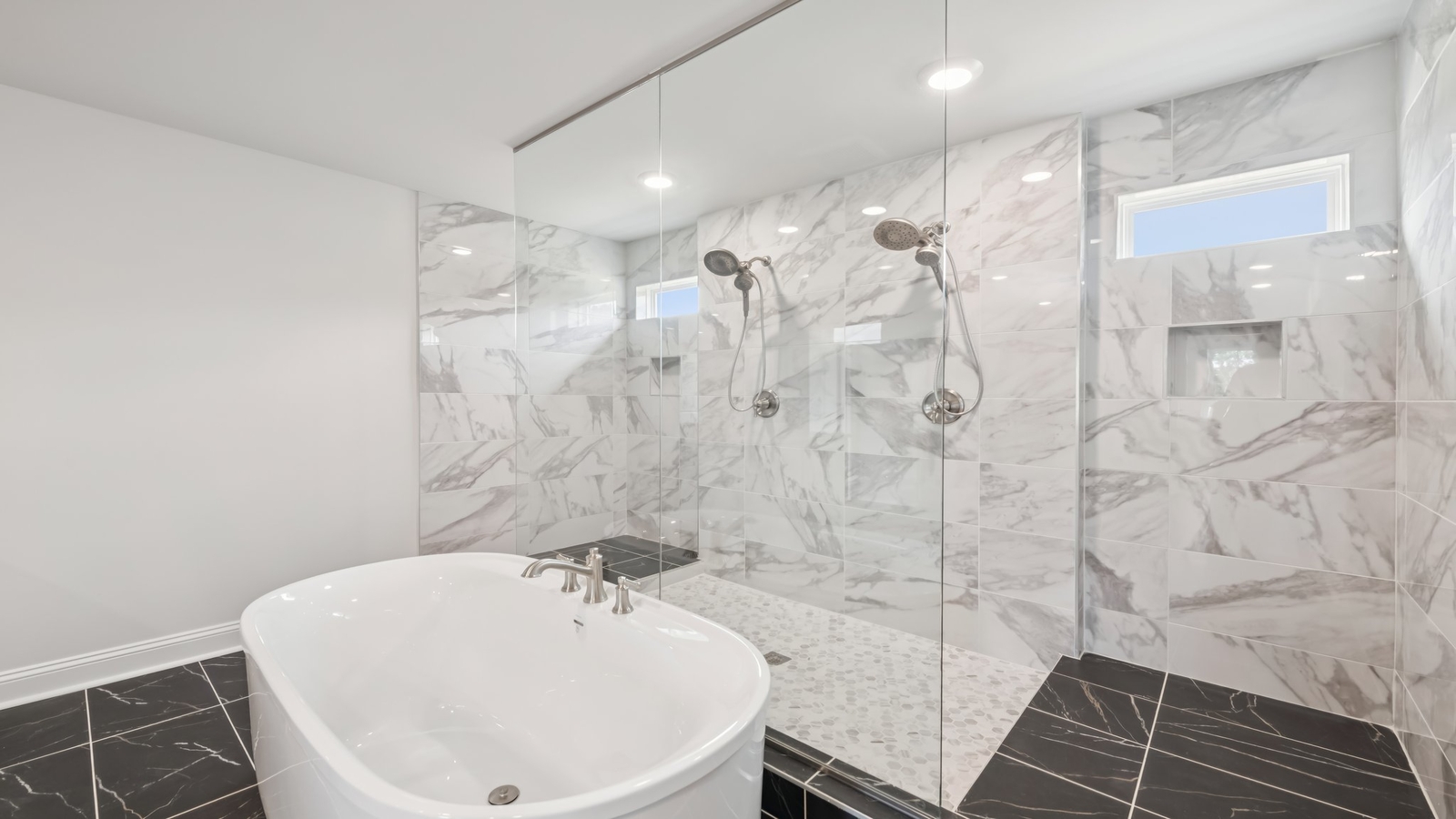 Owner’s en-suite new build home offers a functional layout with a walk-in closet, and spa-like en-suite shower-bath designs