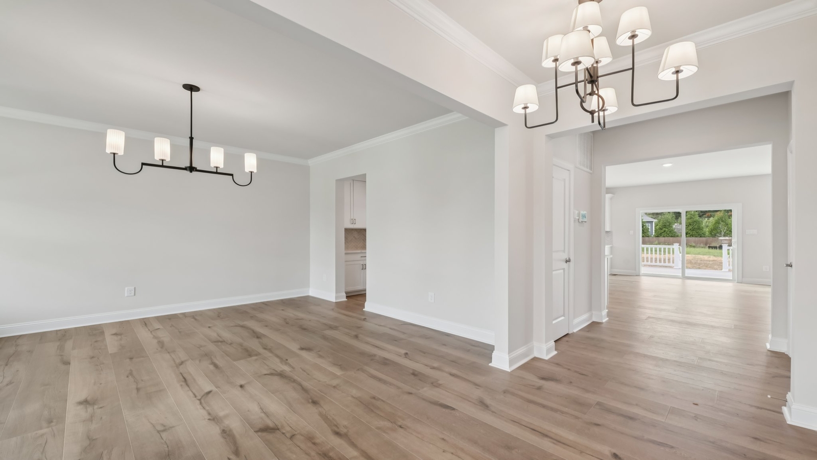 Kitchen and dining layout with new big island with seating, pantry, new appliance suite throughout