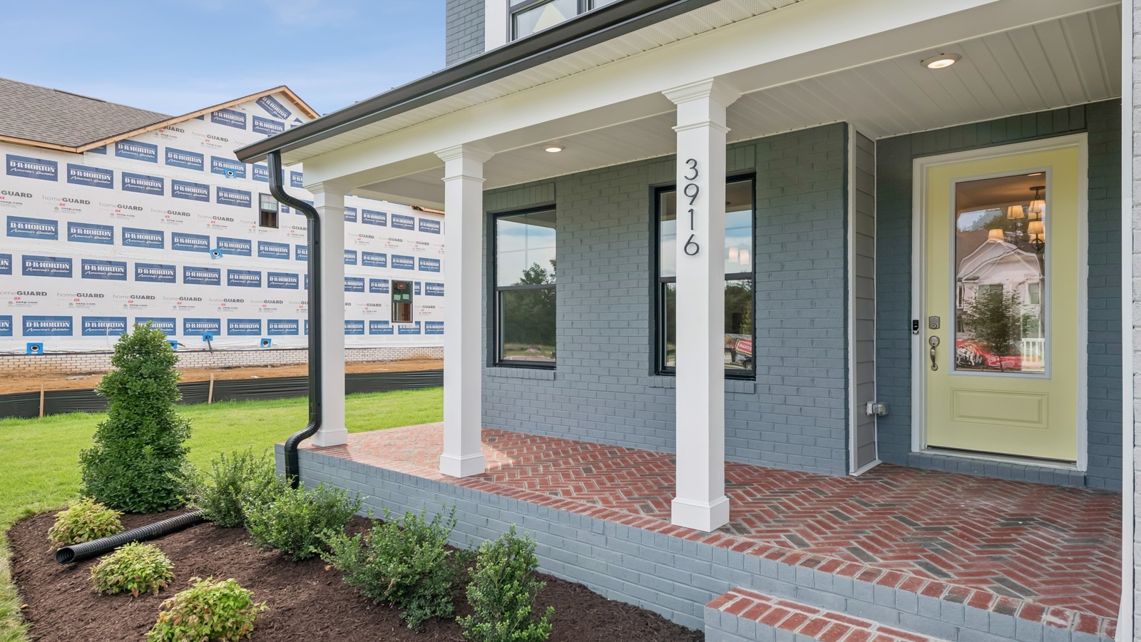 Sheppard Mill home front porch and main door entry, access to main level with quality flooring, and opens to hallway