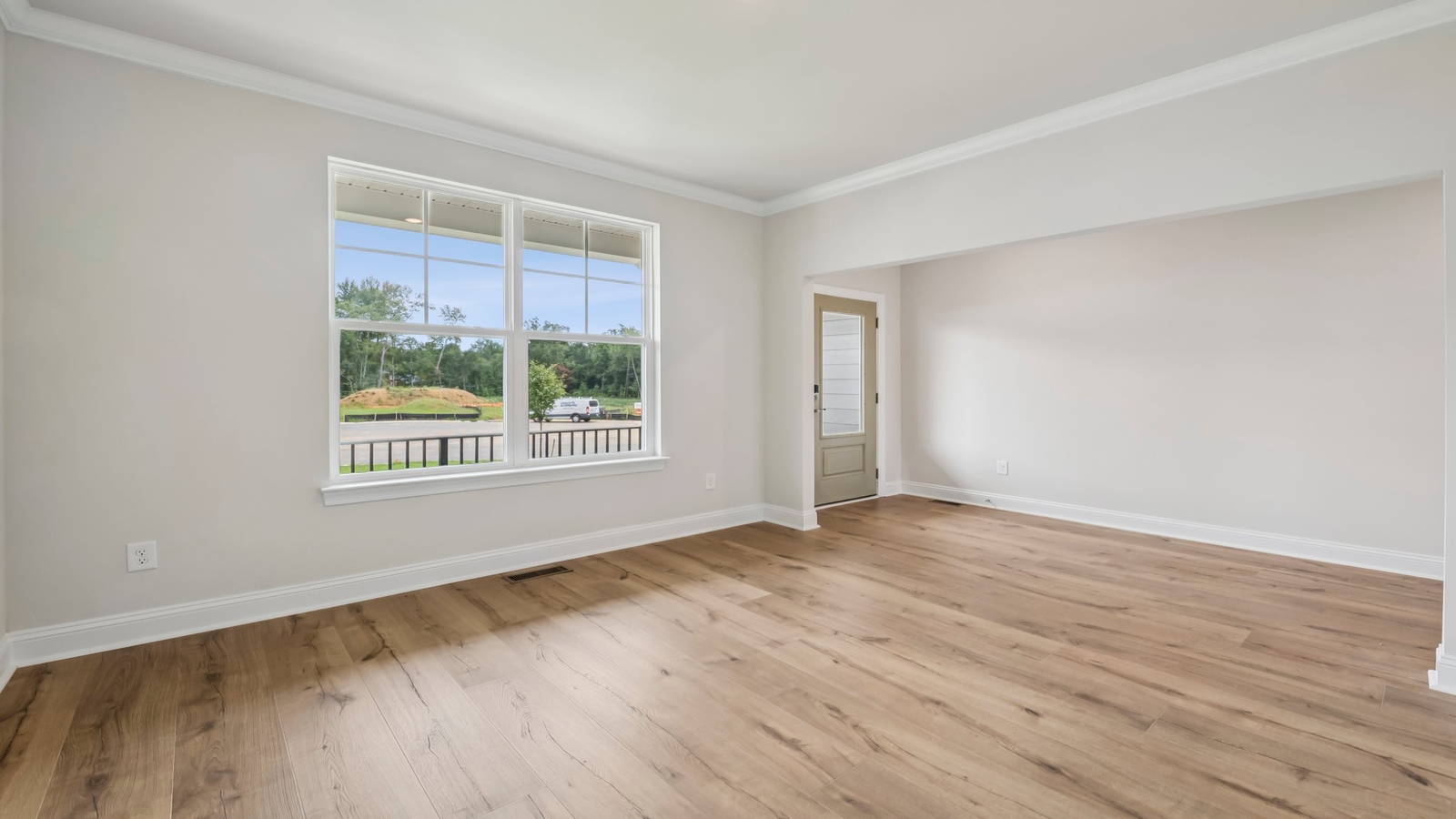 Open Concept living room nearby the kitchen-dining areas with wide sightlines and clean finishes Sheppard Mill