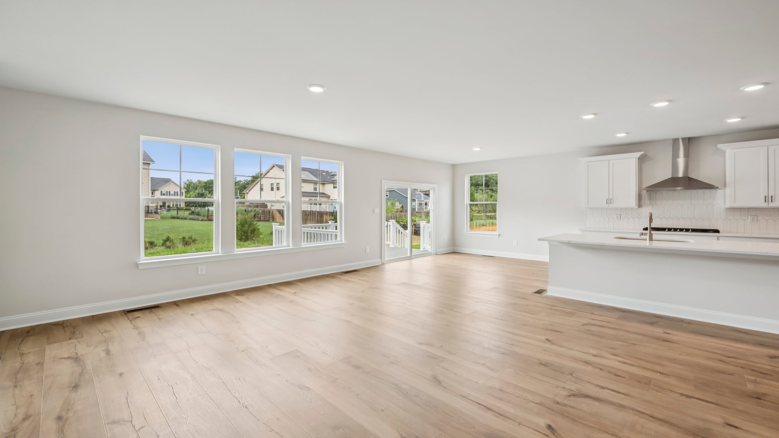 Kitchen, dining, and living areas form one flowing main living space designed for comfort at Sheppard Mill