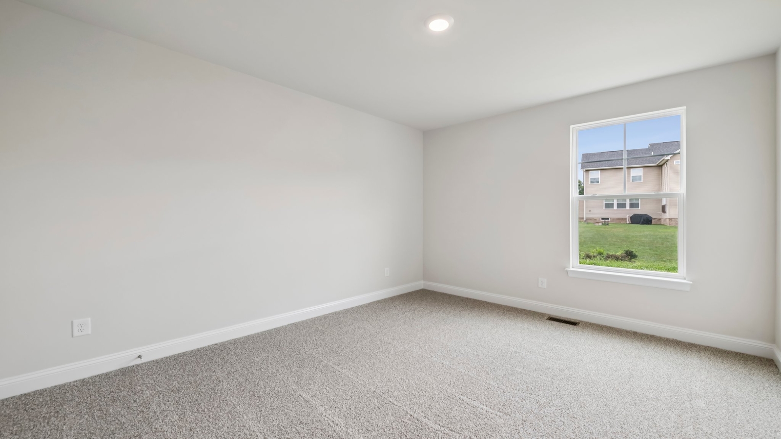 Primary bedroom in this New Home features ample space, double windows, quality carpet, a Walk-in Closet, private En-Suite Bath