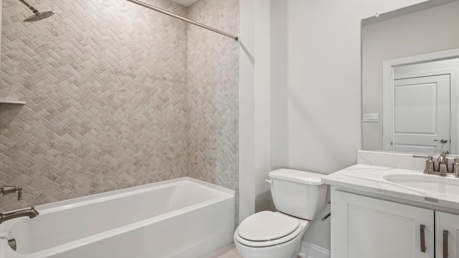 Family bathroom with decorative tile, storage, tub-shower combo in Sheppard Mill