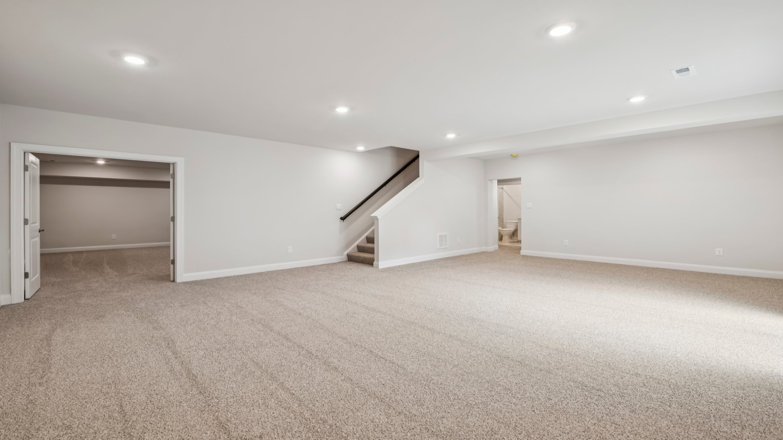 Finished basement flex space with quality flooring, open layout for study, crafts, game or family room use in Sheppard Mill