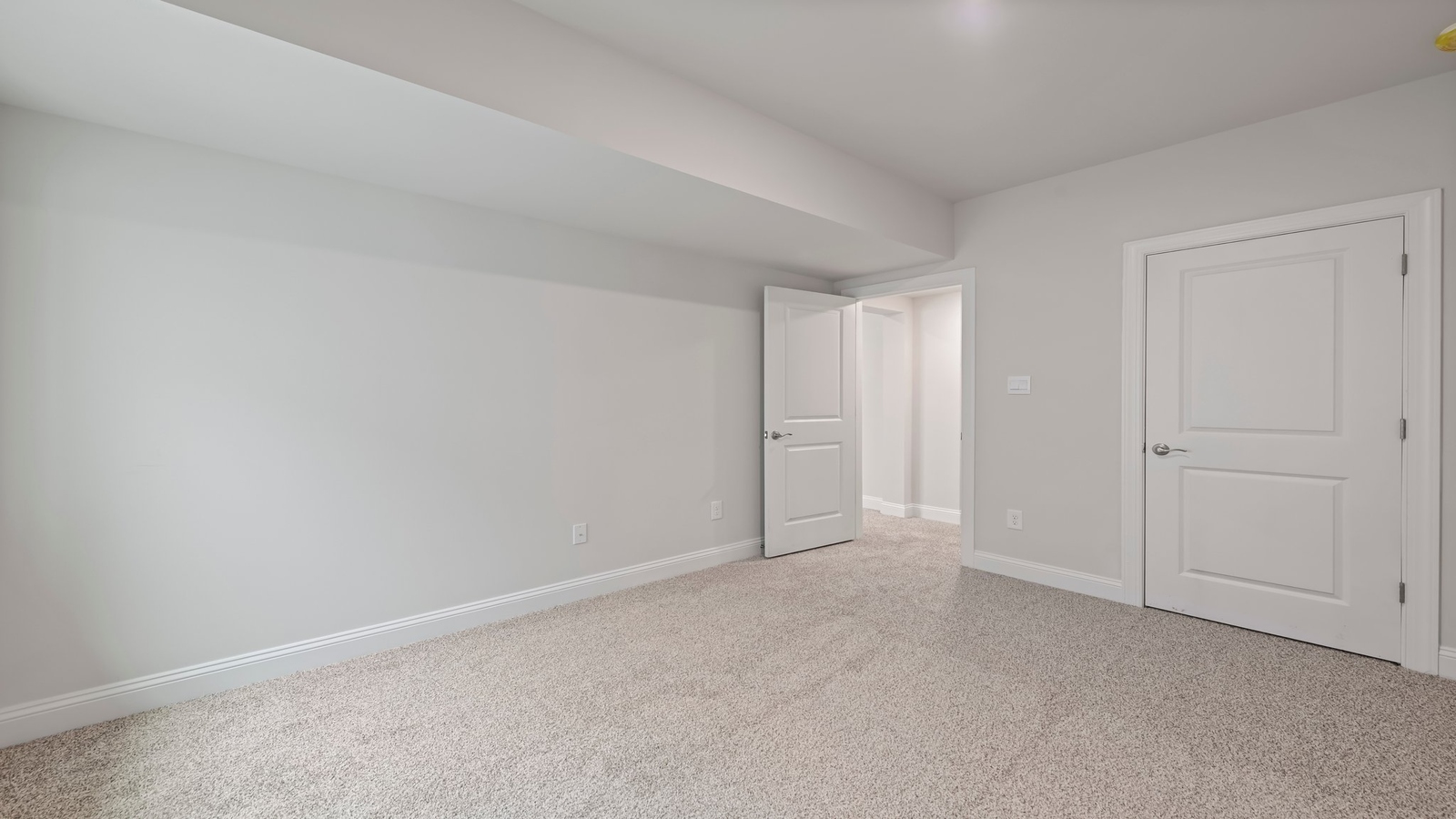 Finished basement with large recreation space and nearby bathroom for added convenience