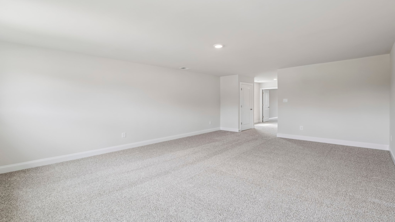 Secondary Bedroom features a traditional closet, quality carpet, and a spacious room arrangement for flexible space design