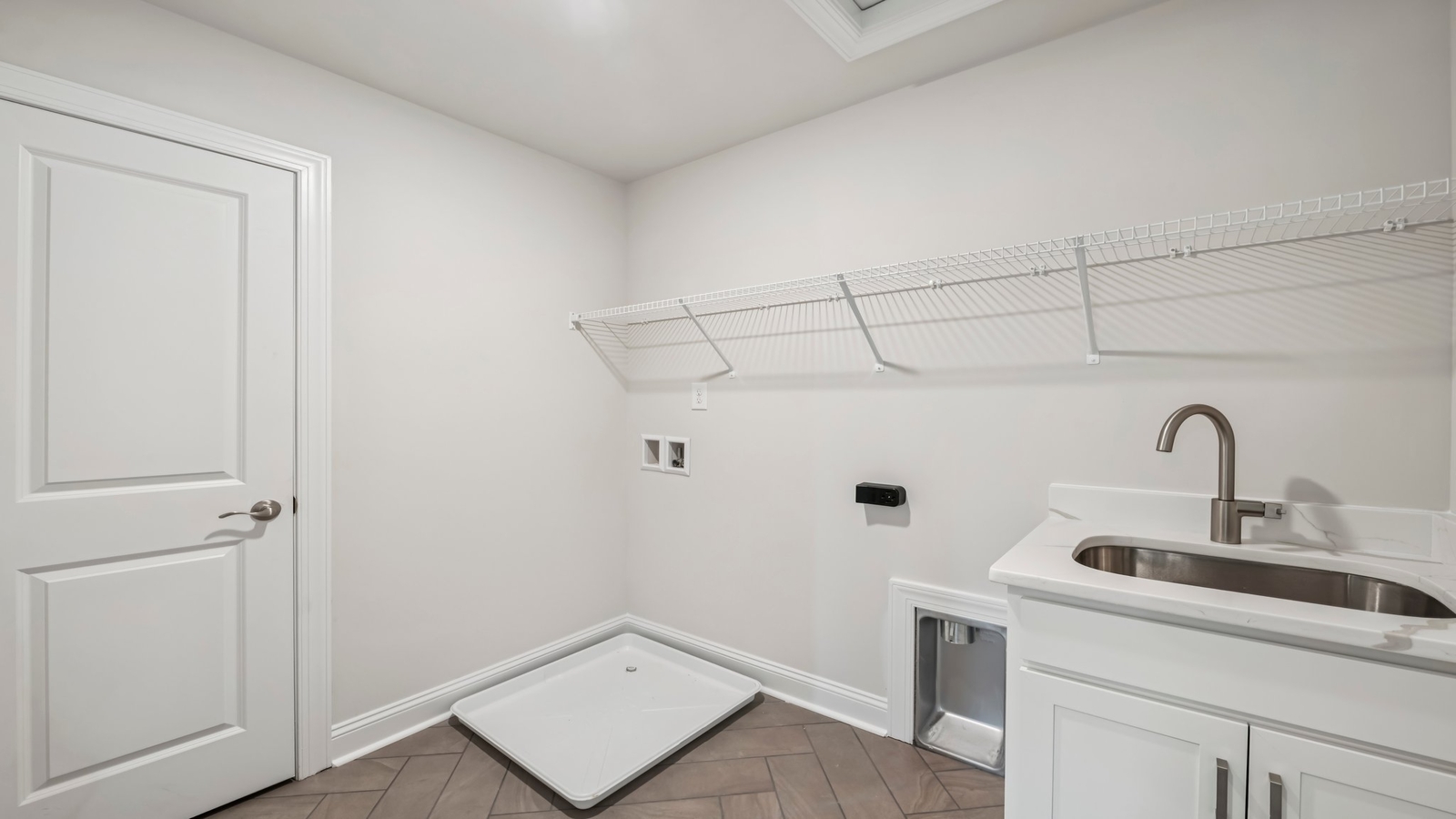 Smartly designed utility laundry in Maidens Farm with new washer dryer, overhead storage