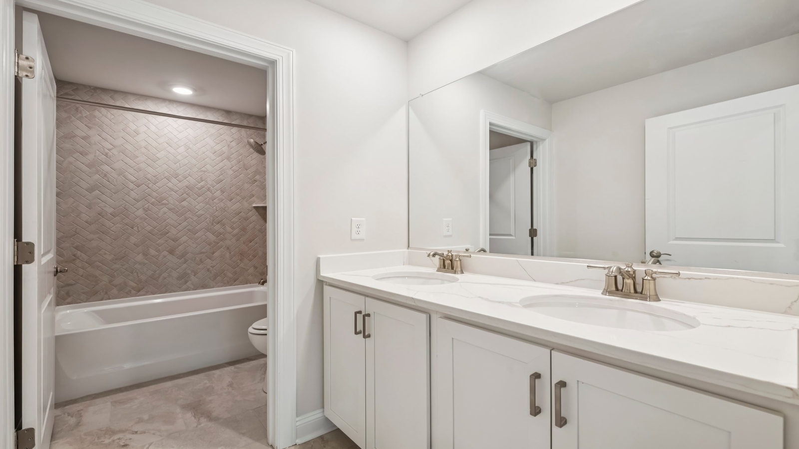 Family bathroom with premium decorative tile, storage, tub-shower combo in Maidens Farm