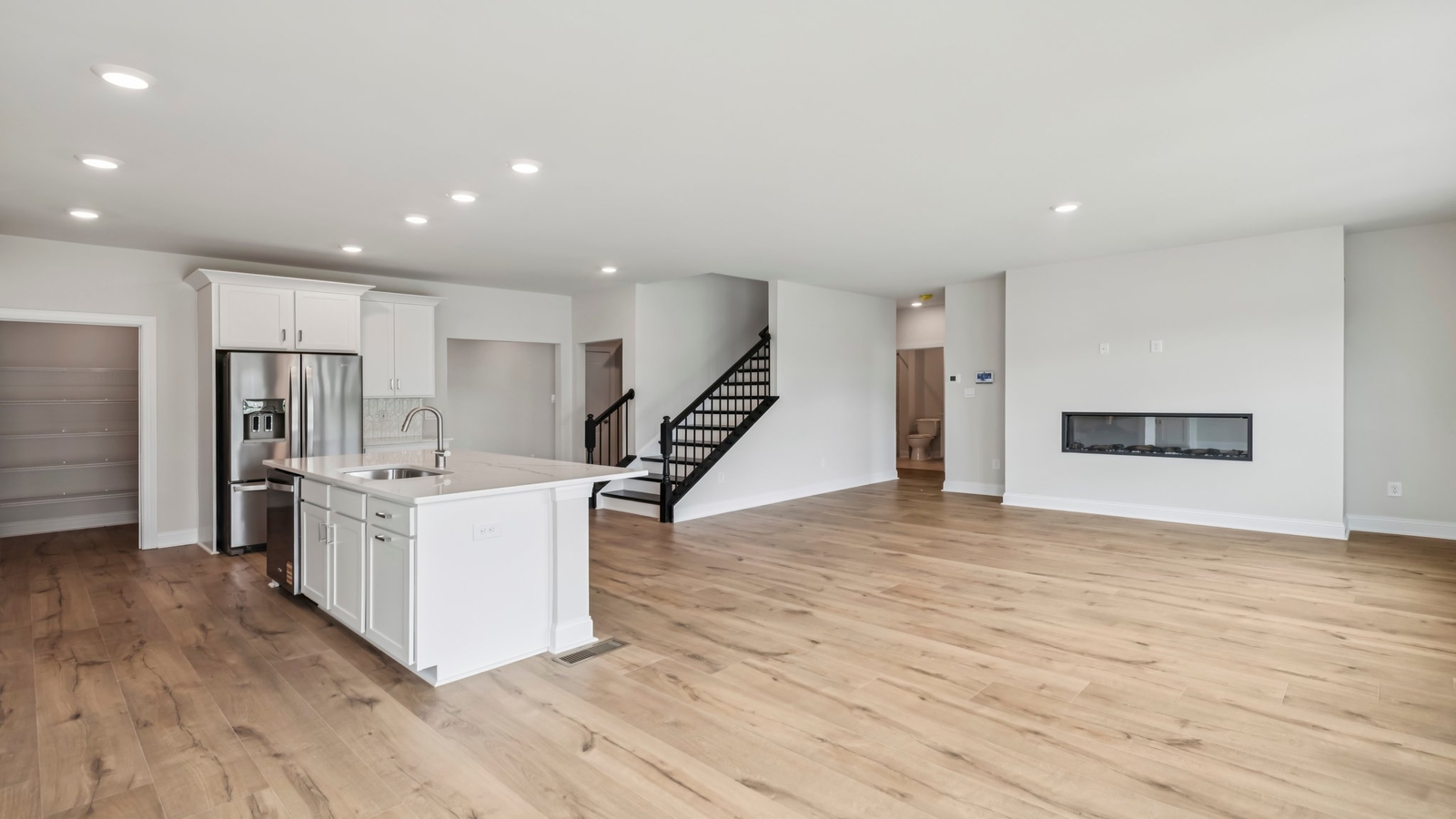 Sheppard Mill dining space with electric fireplace, unified kitchen, living room, in one practical main space