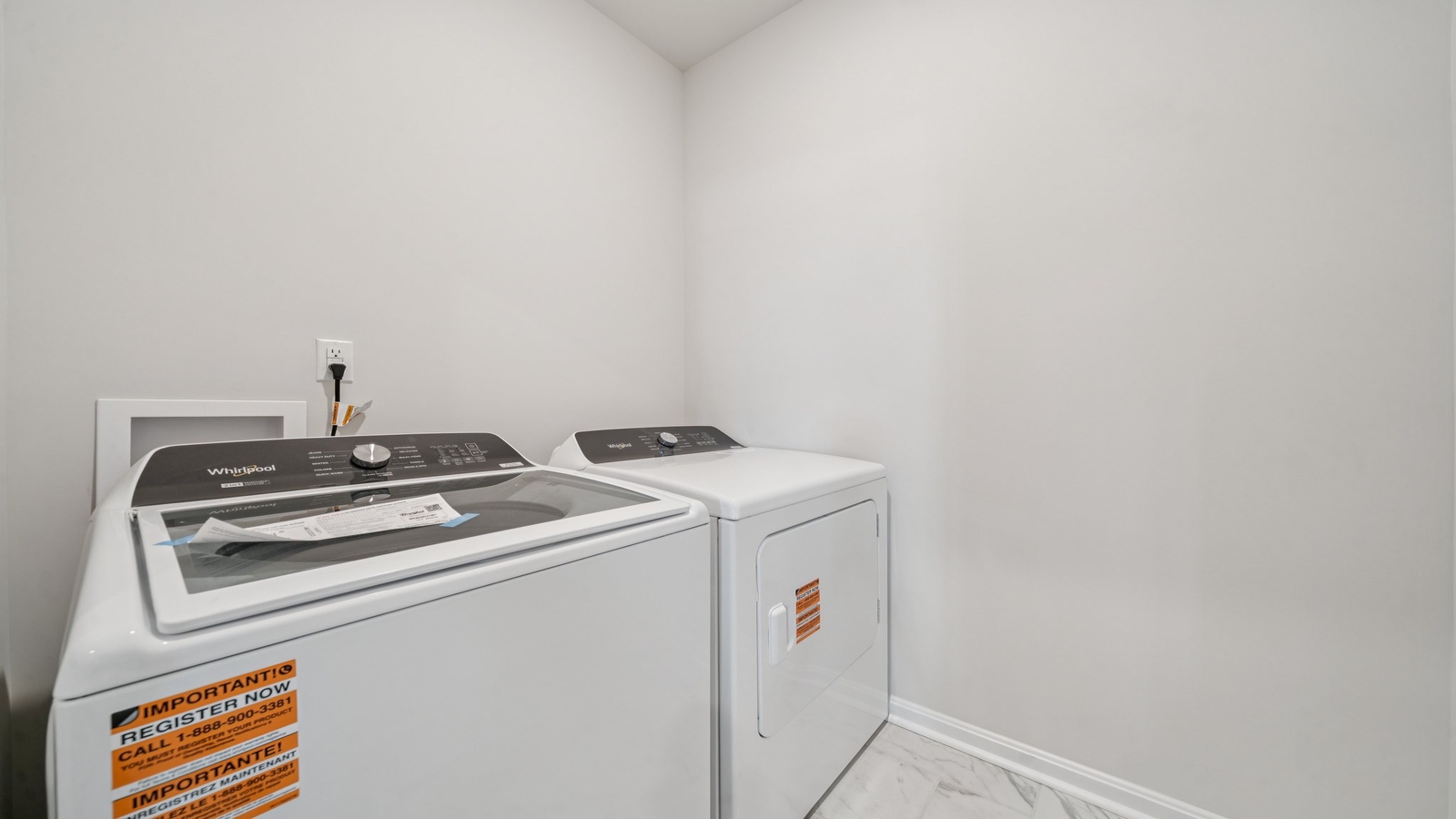 Smartly designed laundry area in Smith Farm  with washer dryer hookups and cabinet storage above