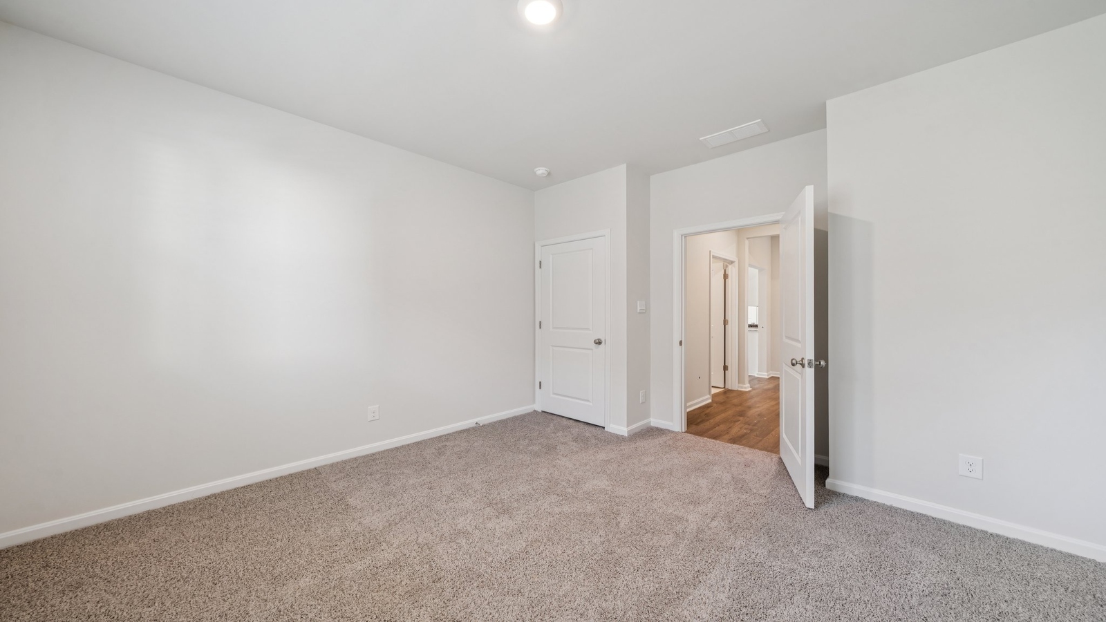 Secondary Bedroom showcases space via single door closet, window, convenient home access Smith Farm