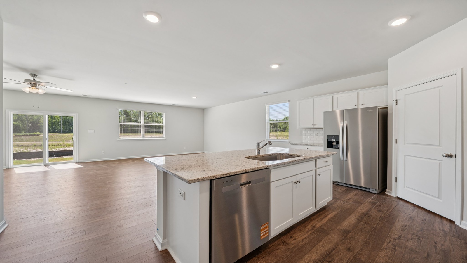 Kitchen island with new appliance suite and cabinet options overlooking the living-dining room at Smith Farm