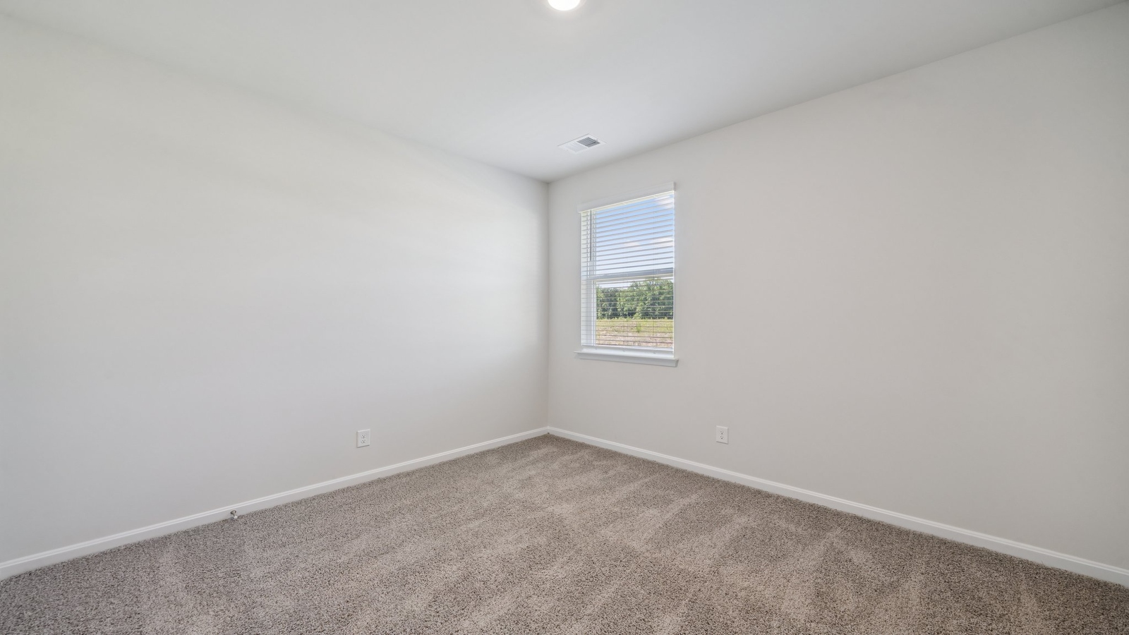Windowed secondary bedroom providing natural daylight