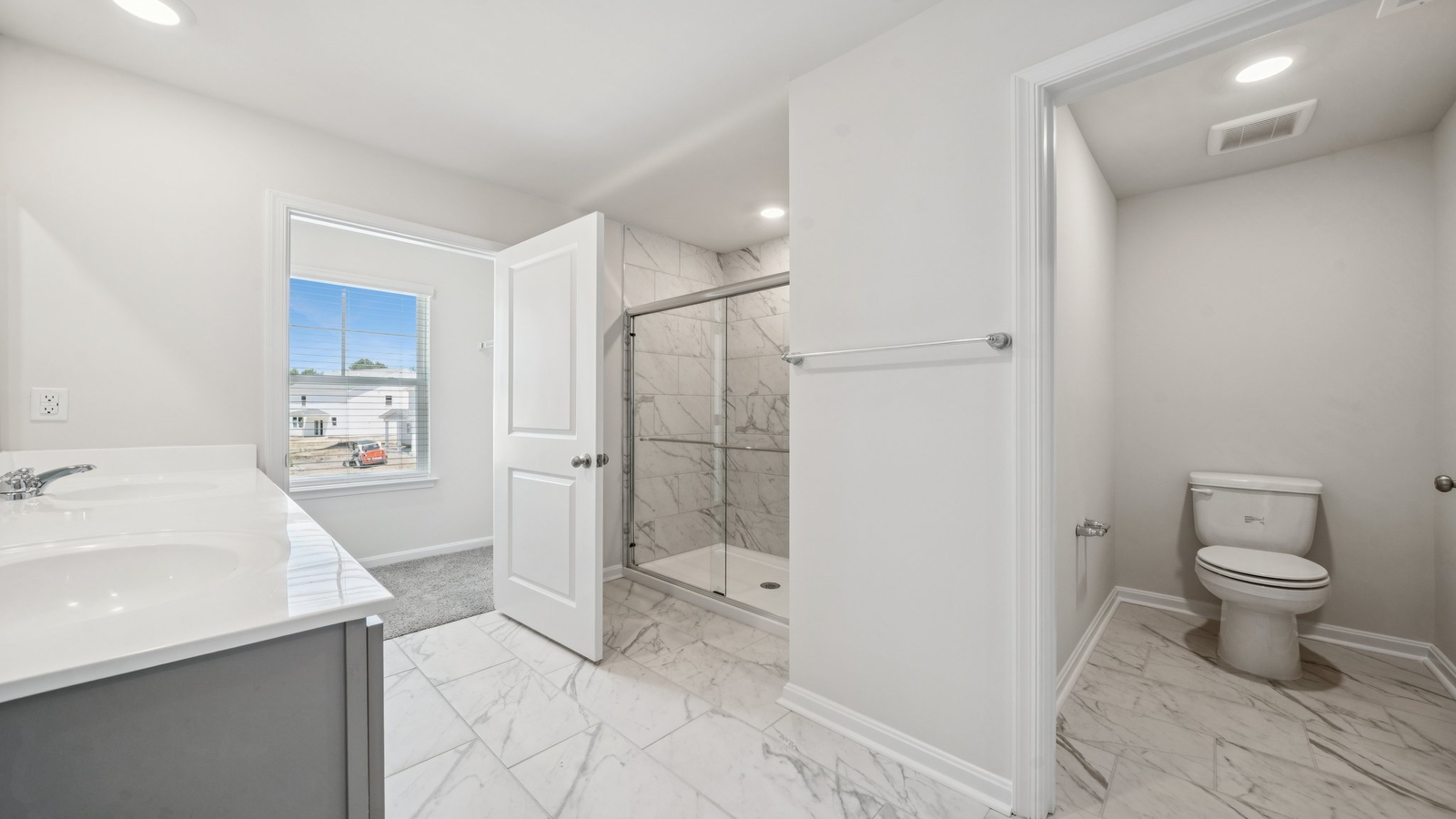 New Home showcases a spa-inspired ensuite bathroom with quality upgrades, open design to shower-tub, and walk-in closet