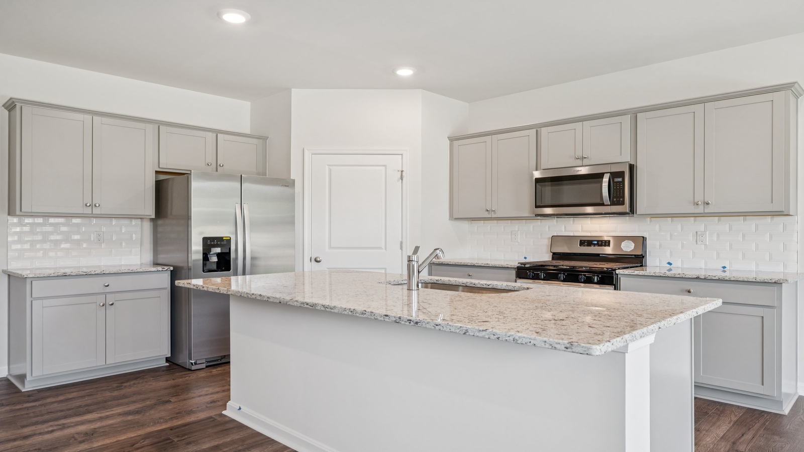 Kitchen island with seating, pantry, prep zones, featuring a New appliance suite, near dining, backyard and living areas