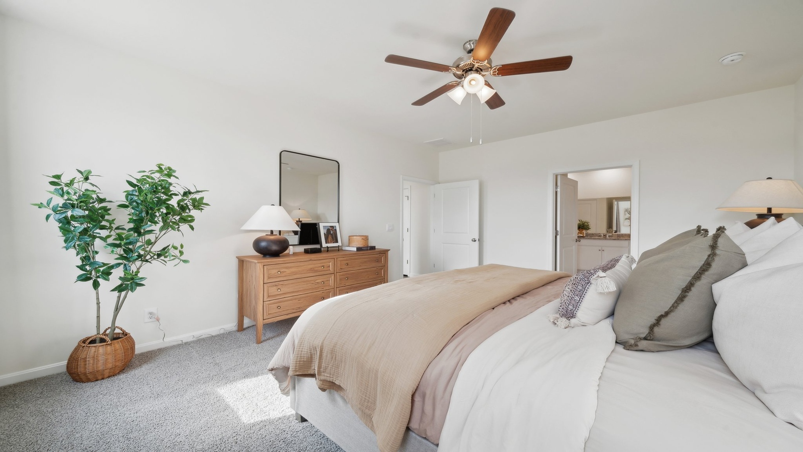 Secondary Bedroom in Smith Farm showcases flooring, a single closet, soft window light, in a finished basement