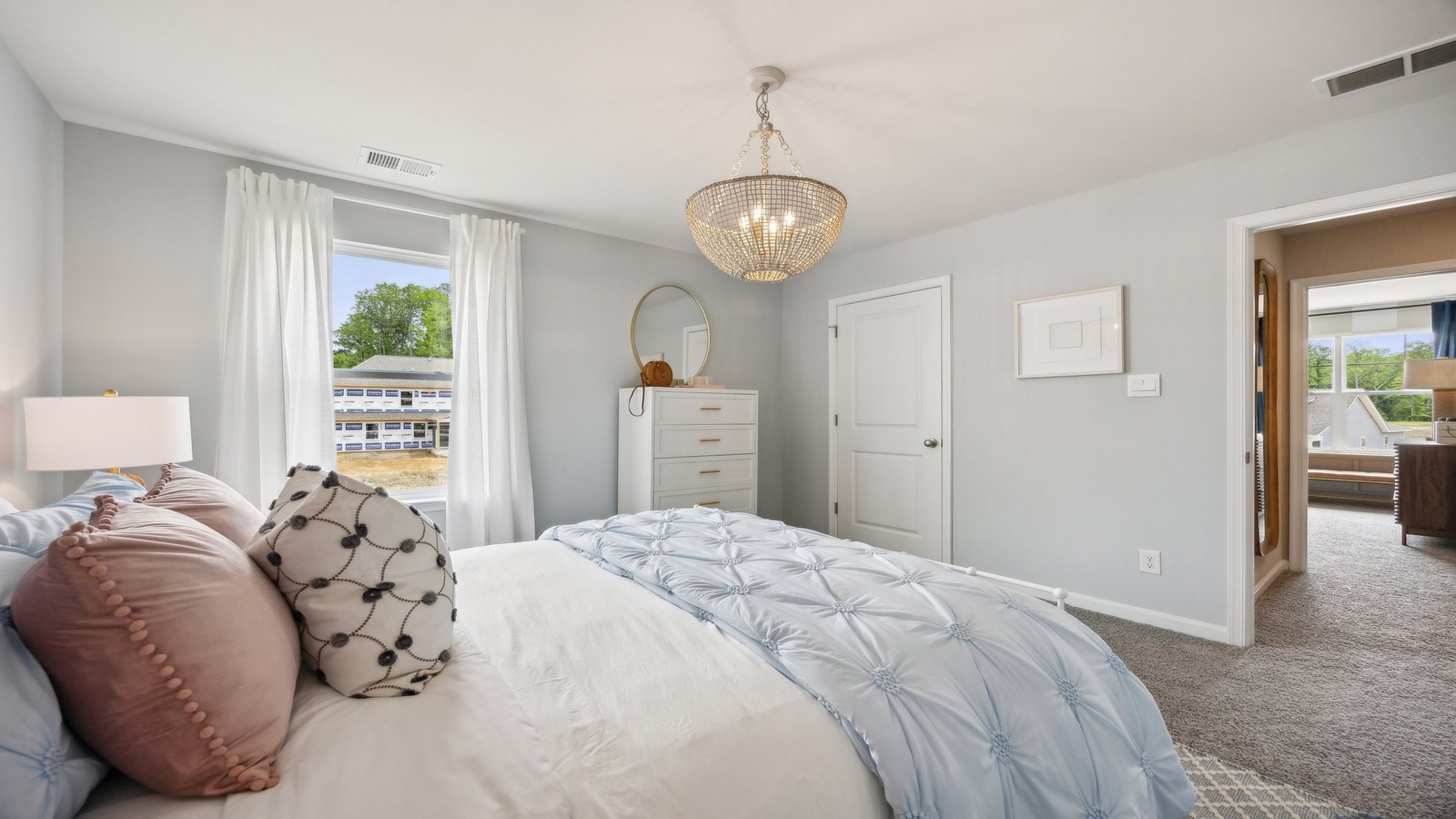 Upstairs loft access with a wide landing entrance, multi-use flow into bedrooms, bathroom, and stairs