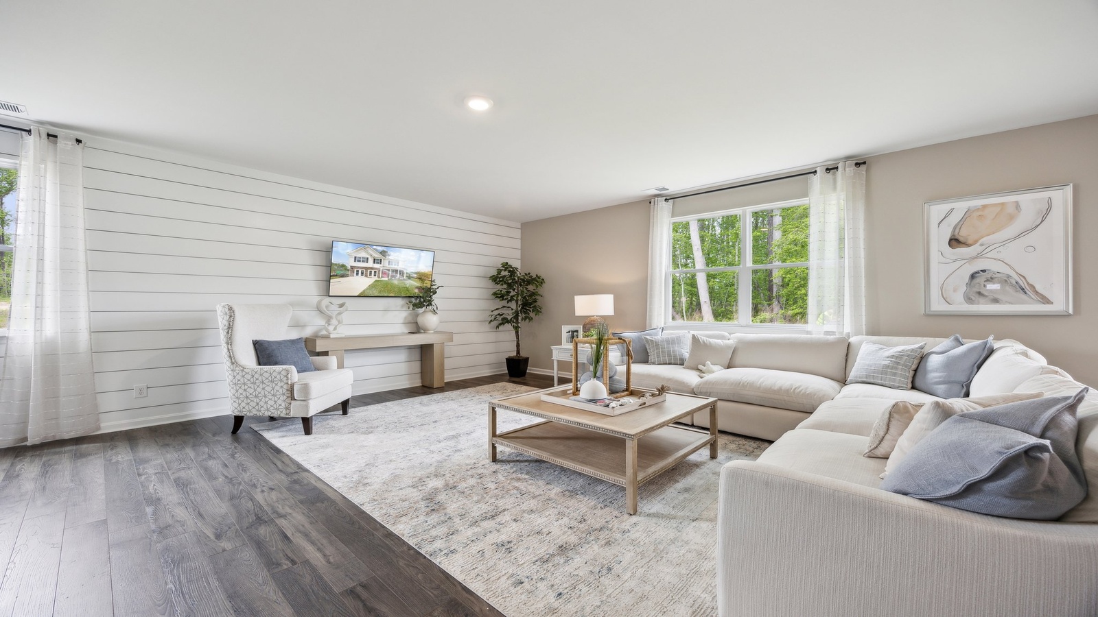 Living room by D.R. Horton showcases connectivity to main areas, and rear patio backyard access