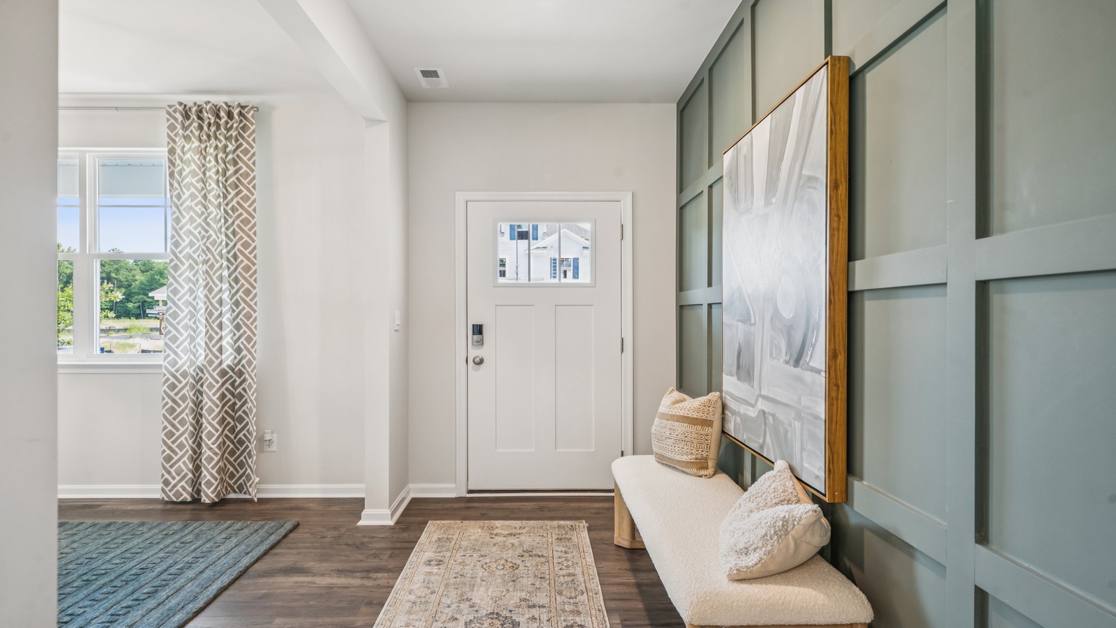 Entry hallway leads from front porch into a fresh open concept designed flex and living spaces Green Spring Estates