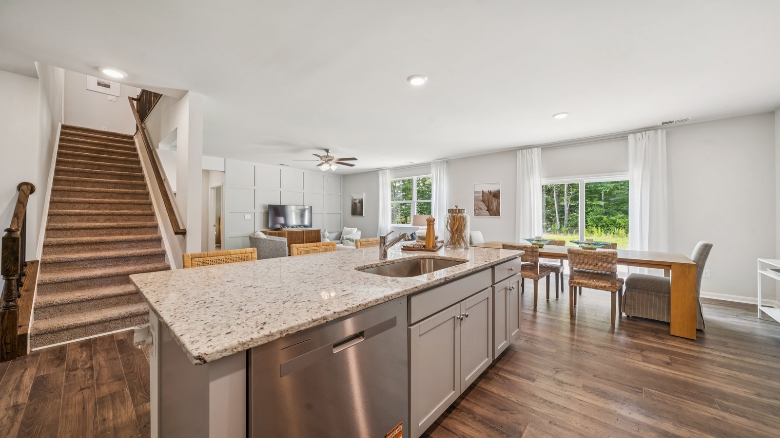 Well designed living-kitchen areas at Green Spring Estates, offering a modern planned efficient use of space with rear yard visibility