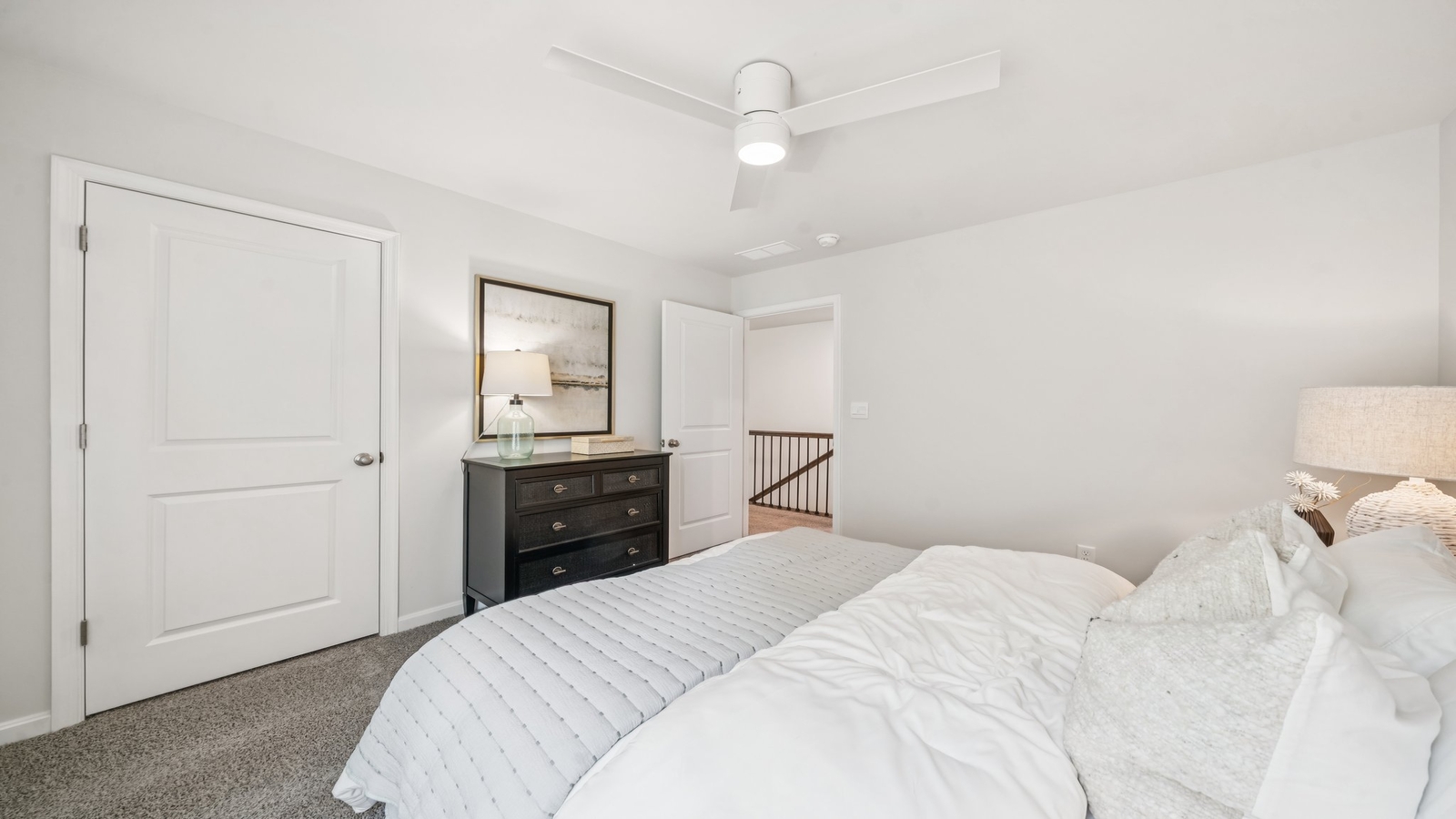 Secondary bedroom showcases space via single door closet, window, convenient home access Green Spring Estates
