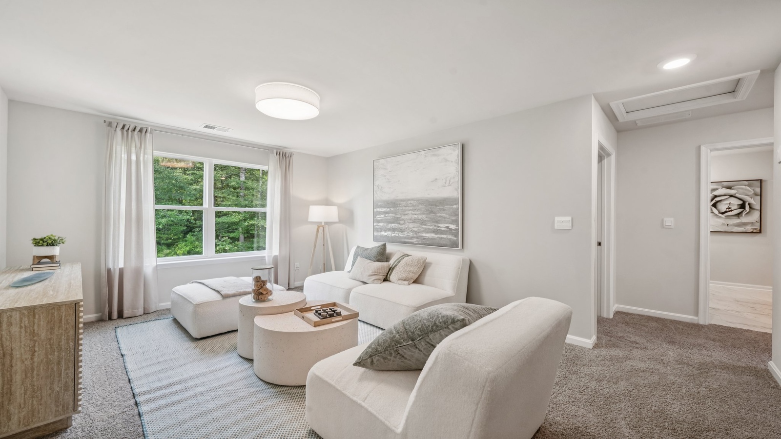 Secondary bedroom with window adding soft exterior light, upstairs connections to shared bedrooms and bathroom