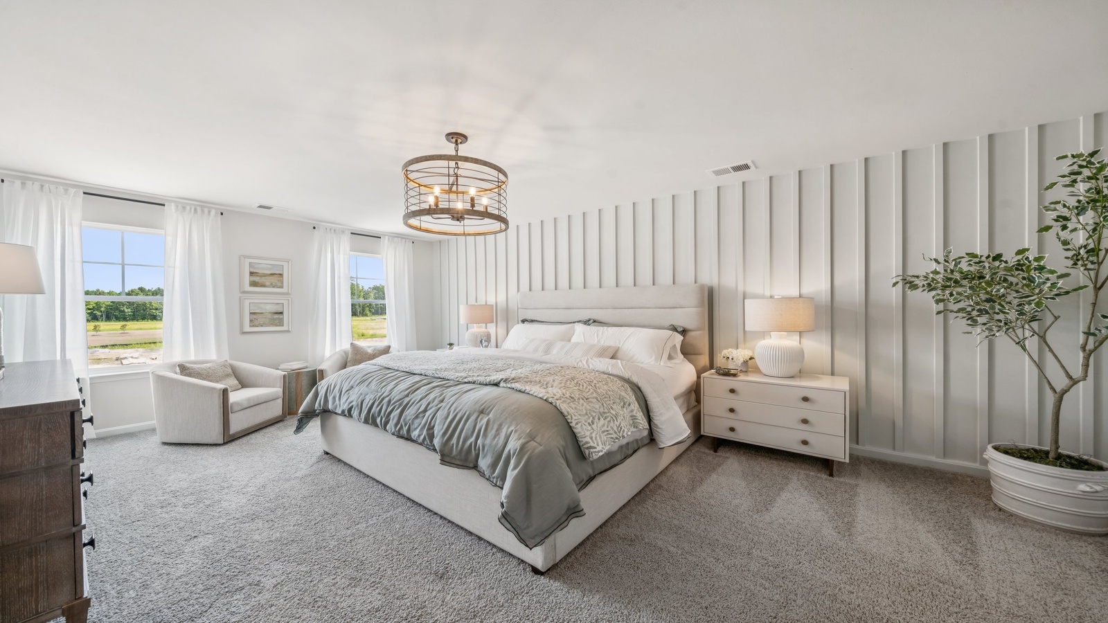 Owner’s suite offers natural window light, spa-inspired ensuite bathroom, backyard view, walk-in closet for everyday style