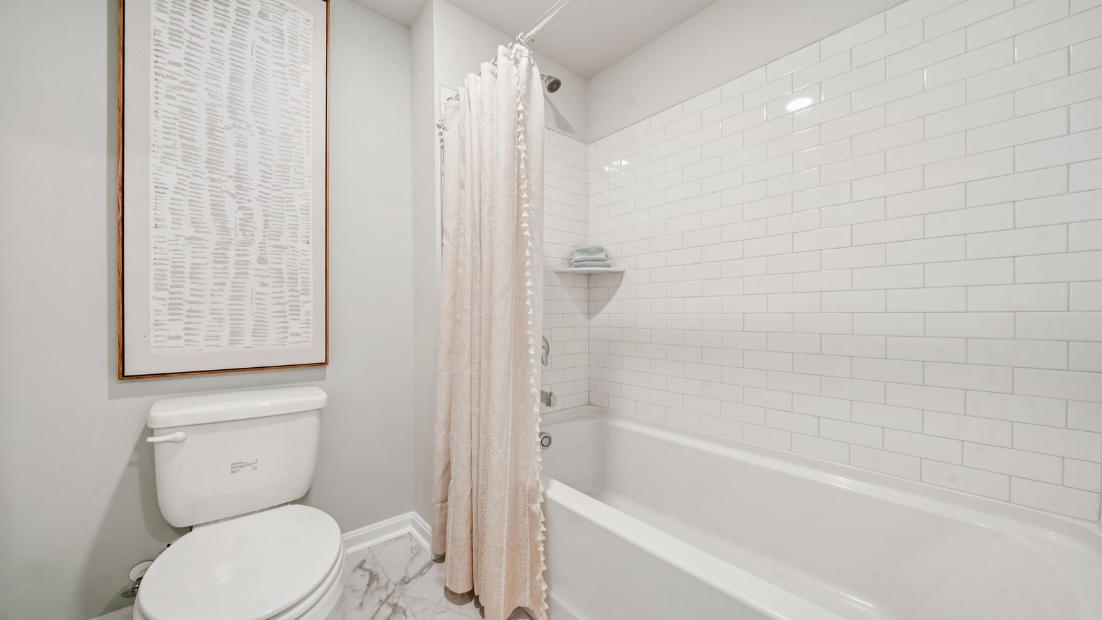 Secondary bathroom with quality combination shower-tub, cabinet storage, vanity, mirror at Green Spring Estates