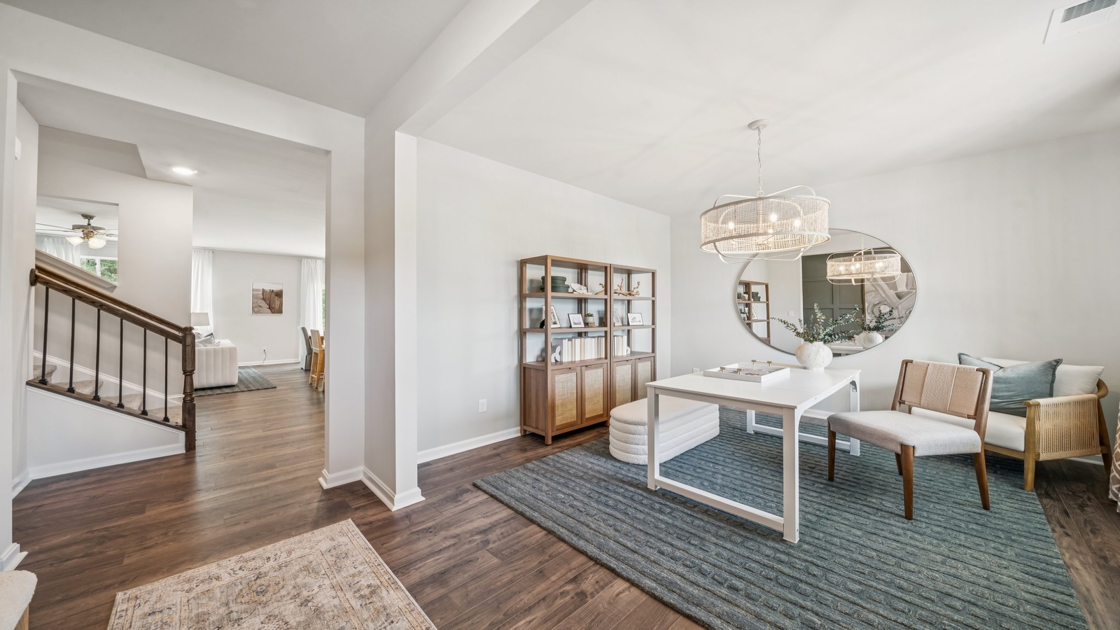 Sun soaked sitting room, enjoys kitchen, main level connections, a stairwell at Green Spring Estates