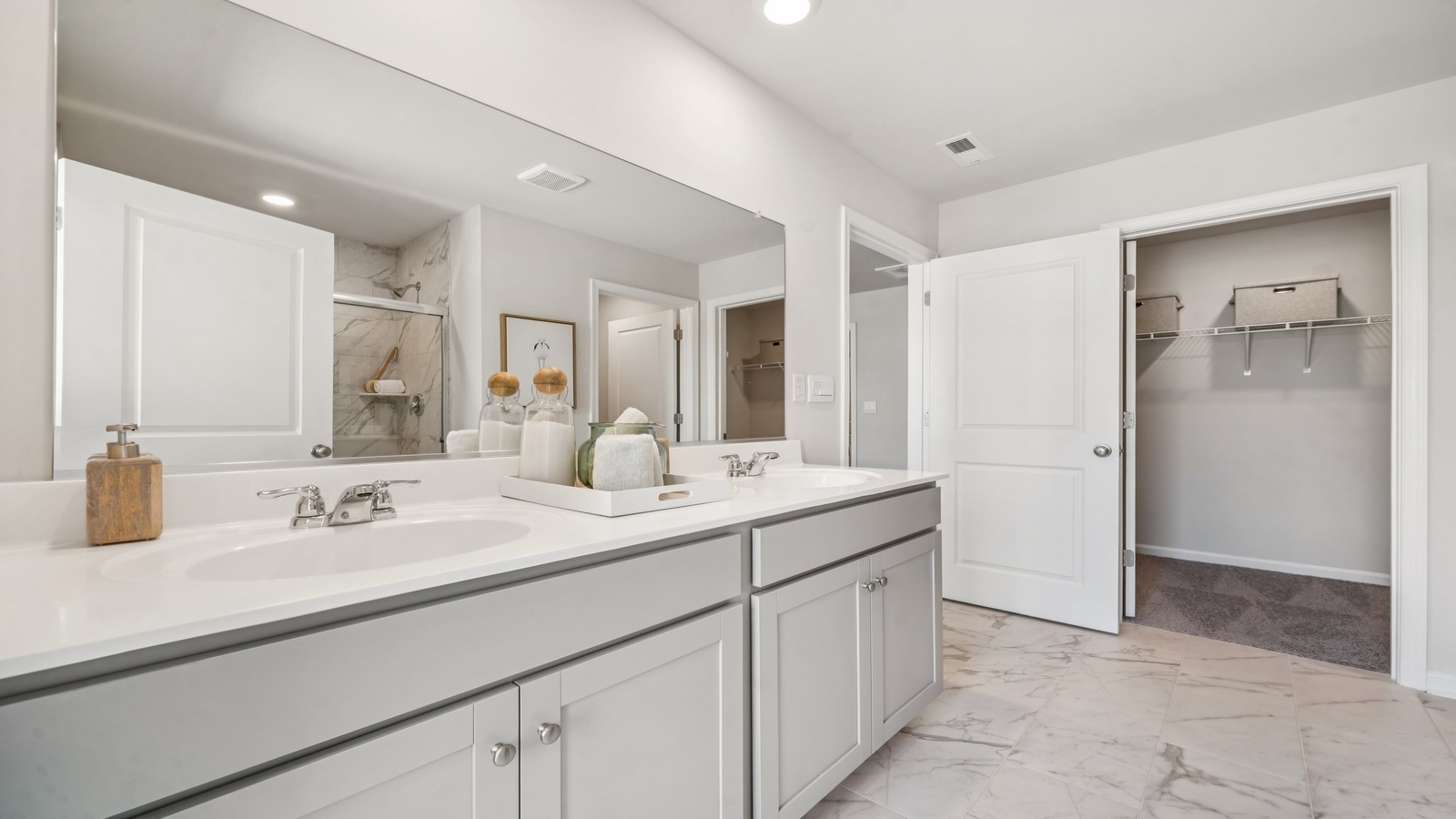 New construction home adds a thoughtful private ensuite, walk-in shower, walk-in closet, full vanity, mirror, backyard view